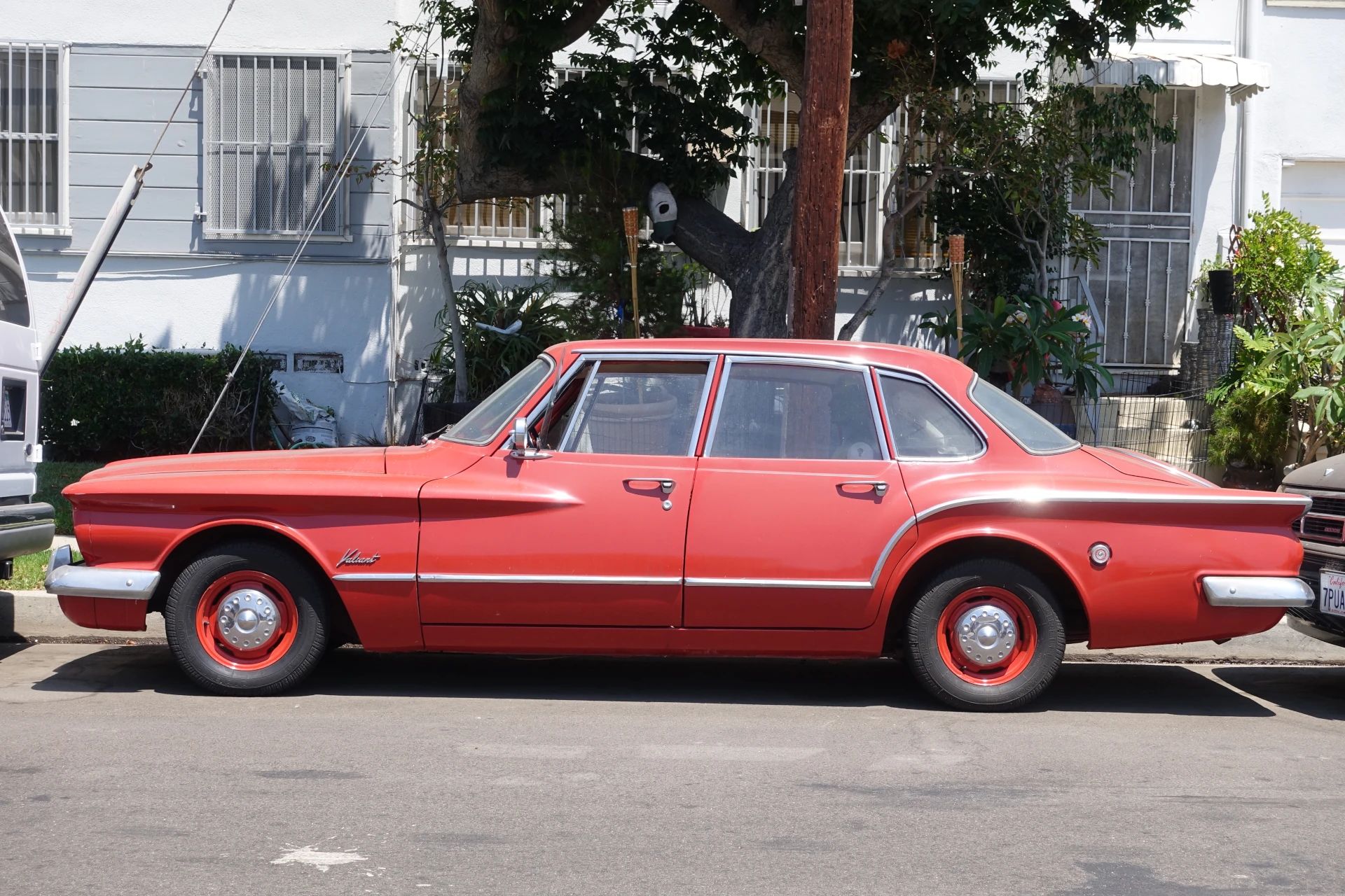 1960–1962 Plymouth Valiant Versus 1986–1991 Ford Taurus – Closer Than They Appear 2 Left side view of a red 1960 Valiant V200 sedan