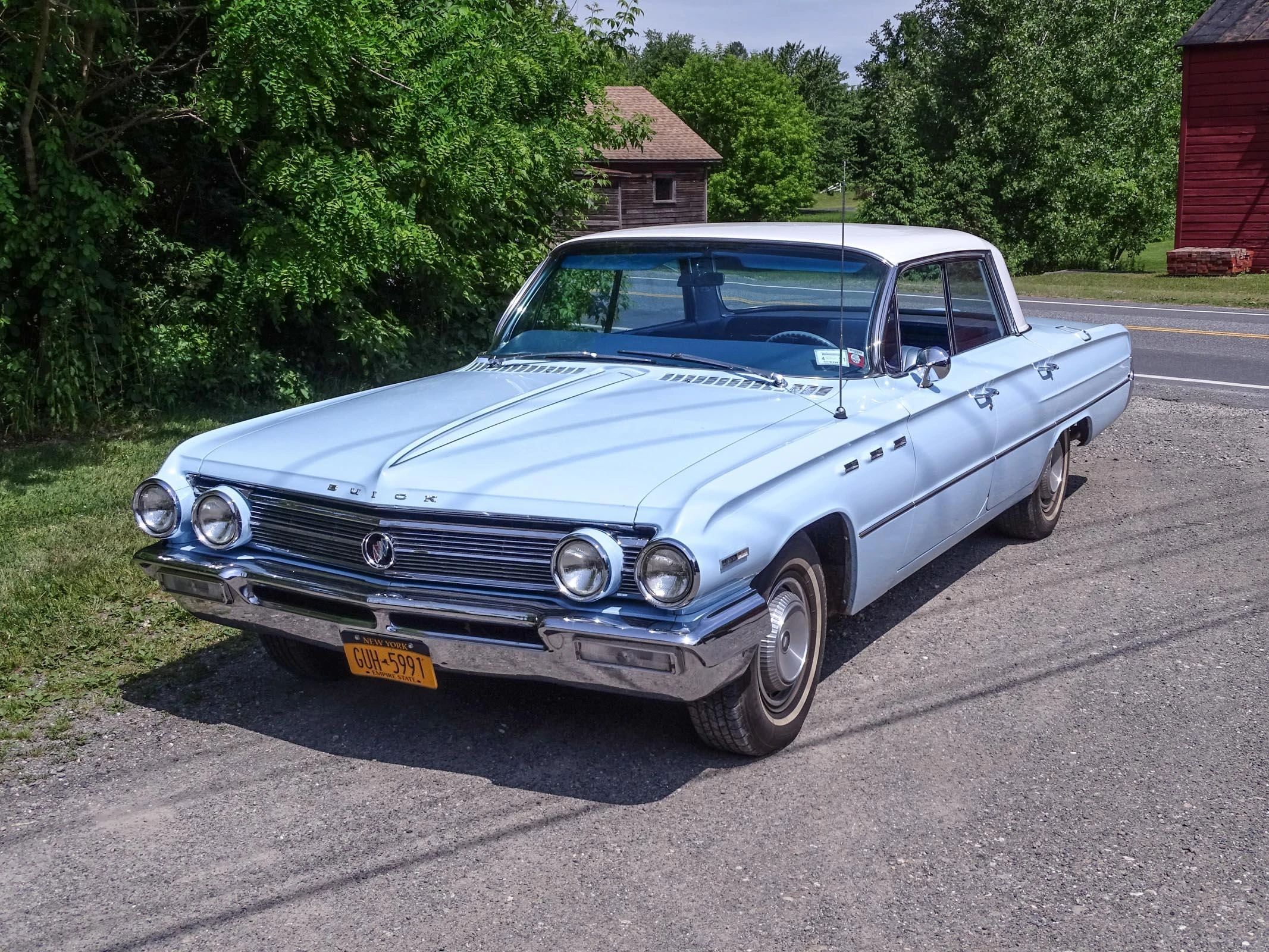 Full-Size Buicks Of The 1960s: How Buick Reinvented Its Lineup Between 1959 And 1970 10 Left front 3q view of a blue 1962 Buick Invicta four-door hardtop with a white roof