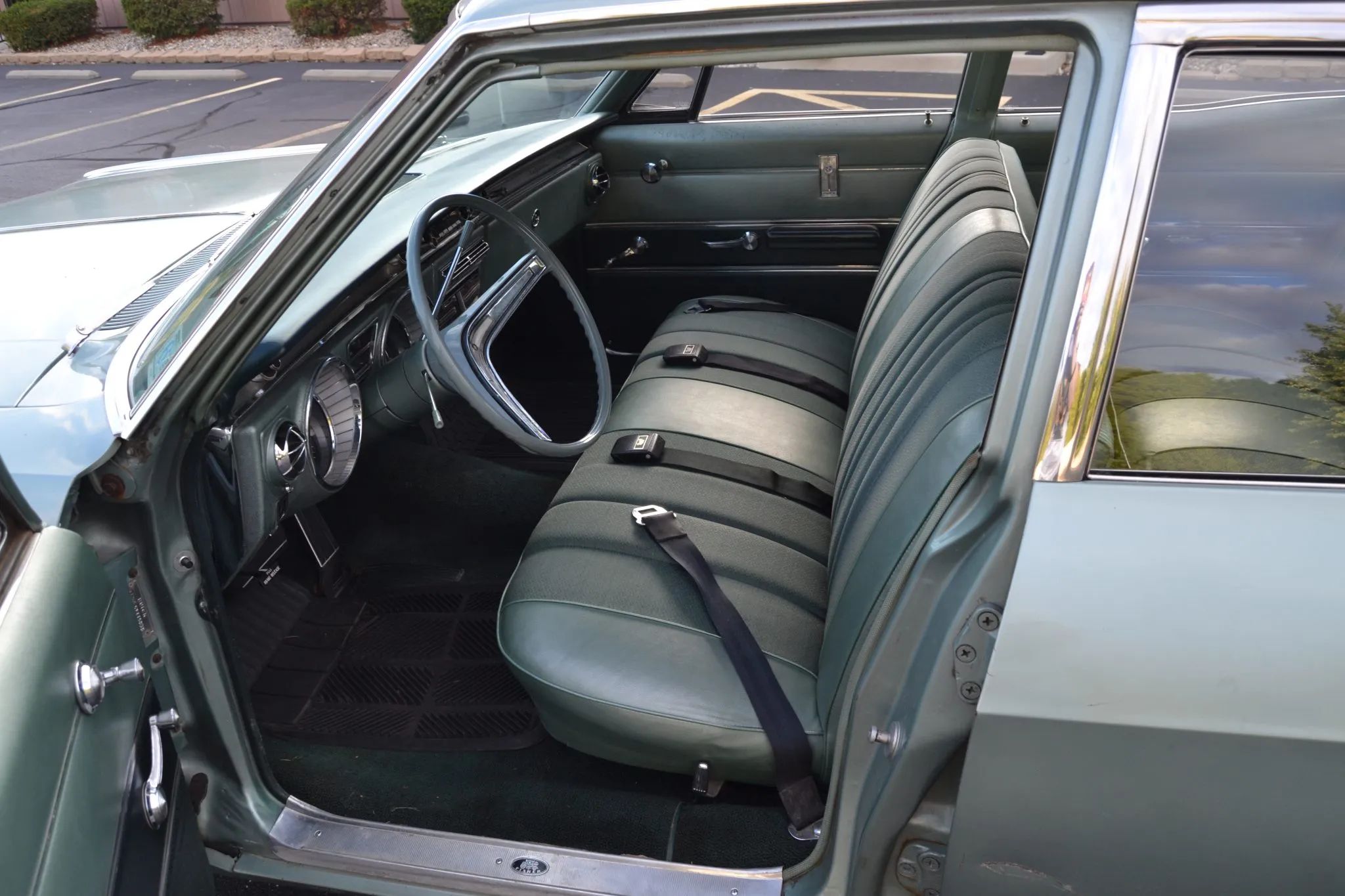 Full-Size Buicks Of The 1960s: How Buick Reinvented Its Lineup Between 1959 And 1970 16 Front seat of a green 1965 Buick LeSabre sedan through the open driver's door