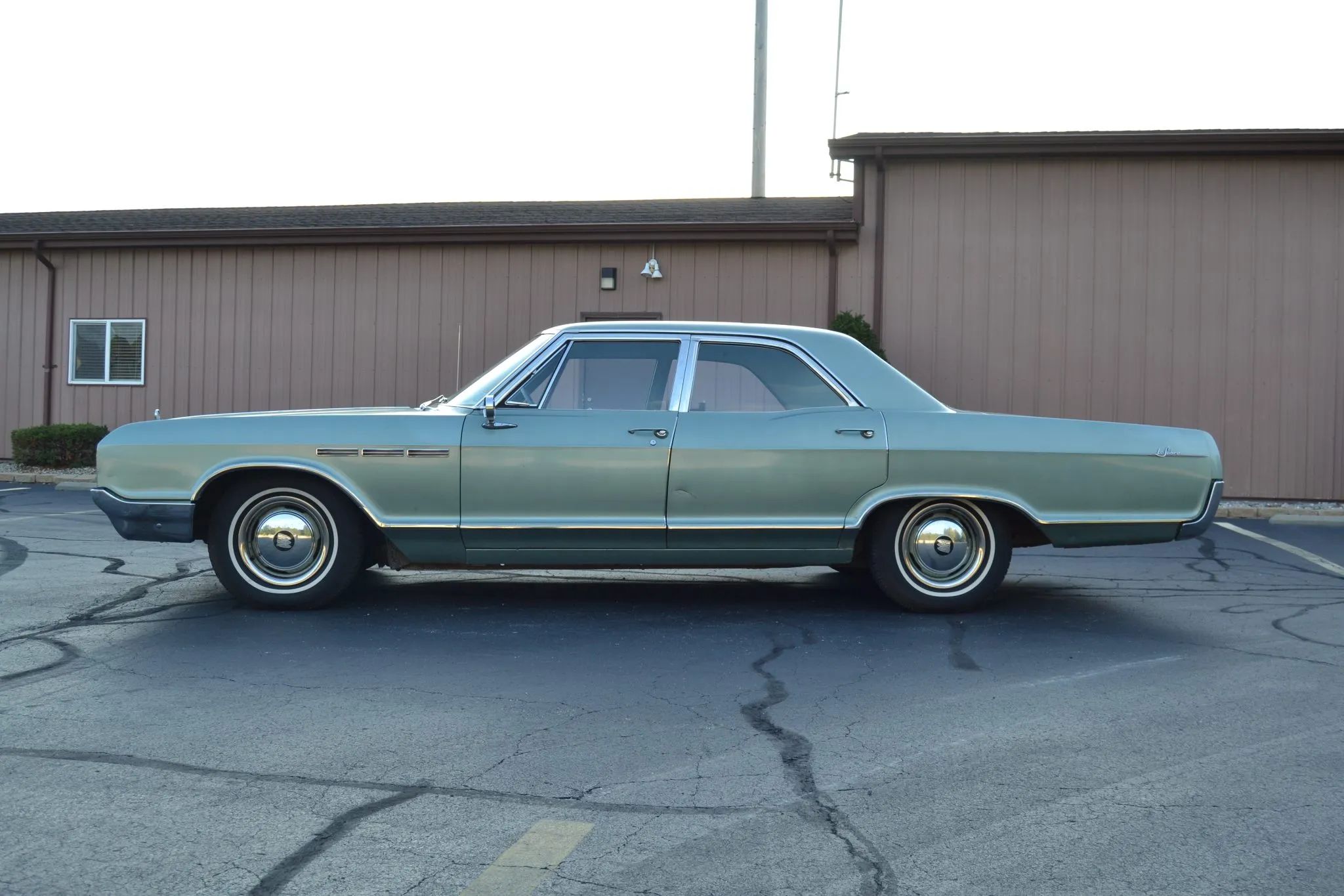 Full-Size Buicks Of The 1960s: How Buick Reinvented Its Lineup Between 1959 And 1970 15 Left side view of a green 1965 Buick LeSabre sedan