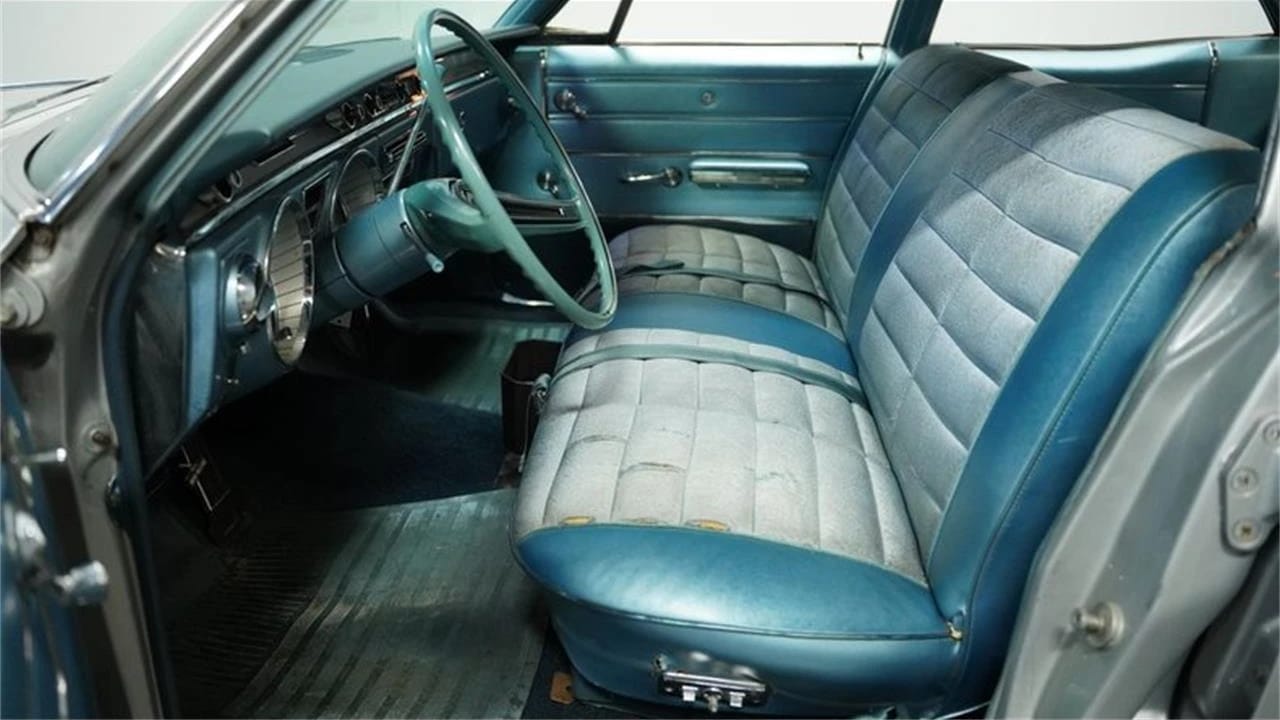 Full-Size Buicks Of The 1960s: How Buick Reinvented Its Lineup Between 1959 And 1970 17 Front seat of a 1965 Buick LeSabre Custom sedan with blue and white cloth and vinyl trim, viewed through the open driver's door