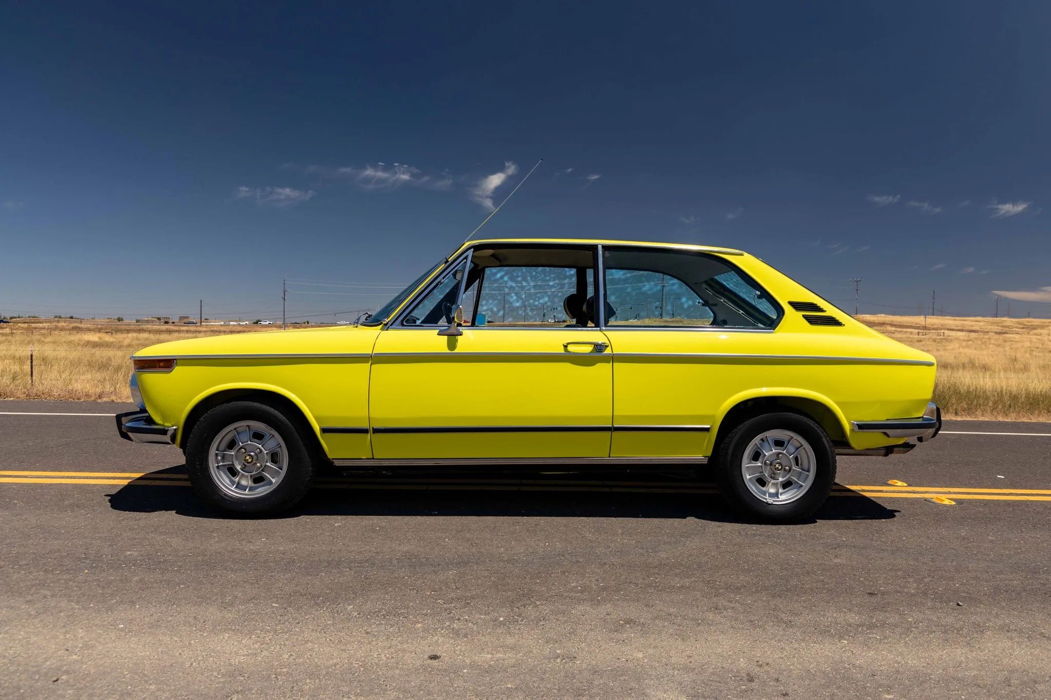 1972 BMW 2000 Touring – Rare BMW 2002 Hatchback Version, Never Sold In The U.S. 9 Left side view of a yellow 1971 BMW 2000 tii Touring with alloy wheels