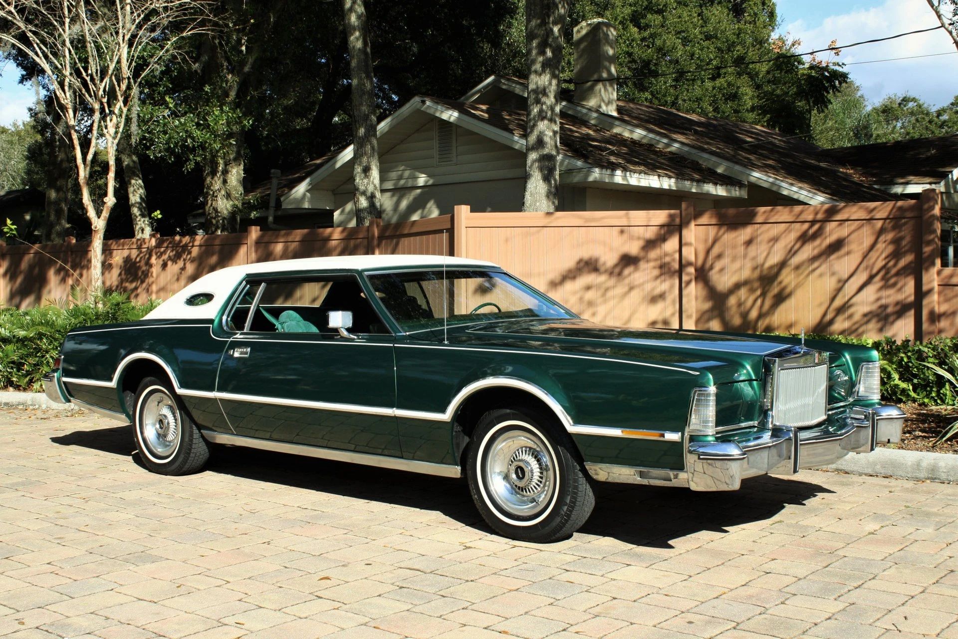 1977–1980 Lincoln Versailles: Slow-Selling, Cynical, But Very Profitable 9 Right front 3q view of a green 1976 Lincoln Continental Mark IV with a white vinyl top