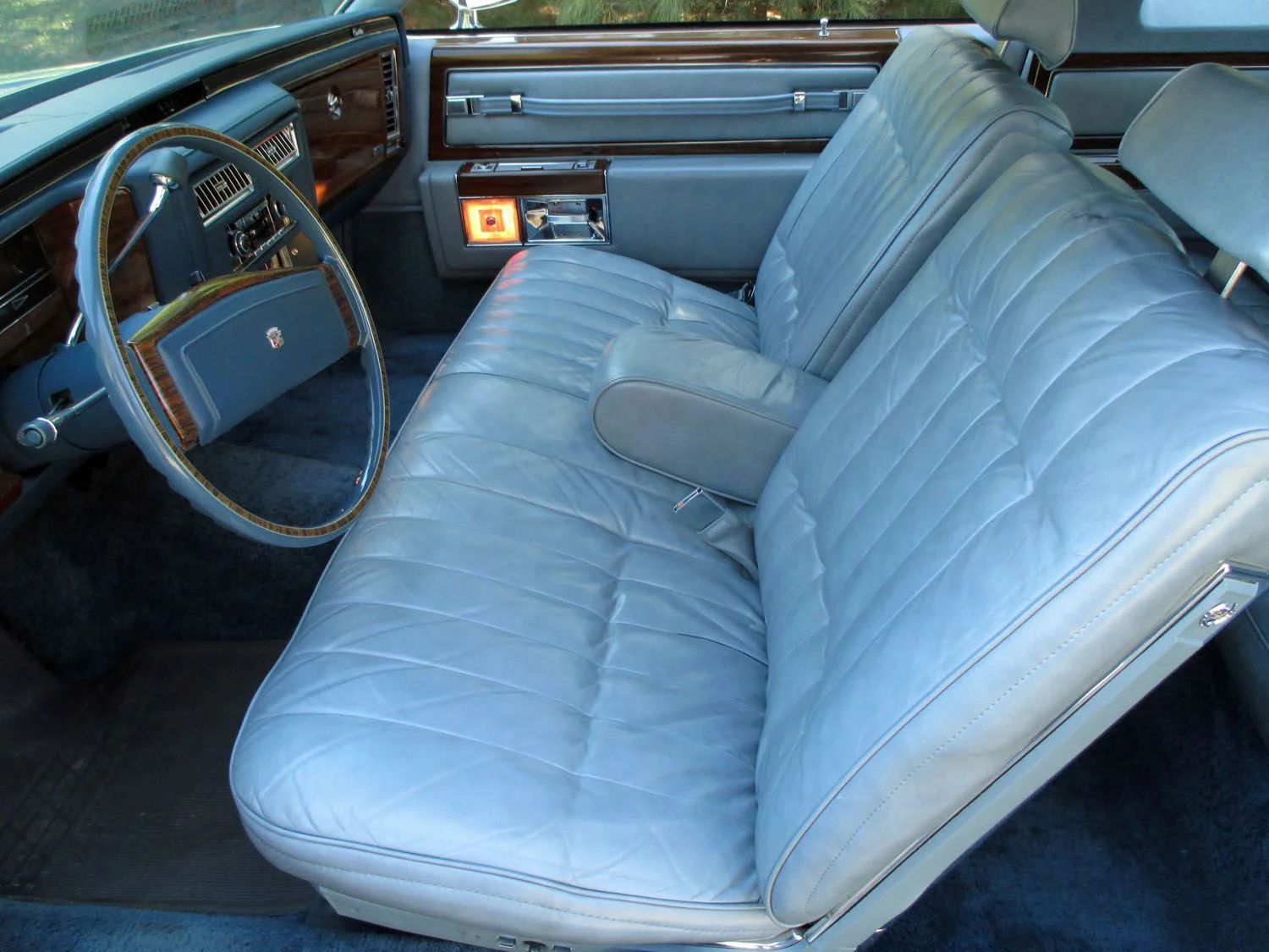 Decade De Ville: Cadillac's Bestselling '70s De Villes 20 Front seat of a 1977 Cadillac Coupe de Ville with a blue interior and leather upholstery