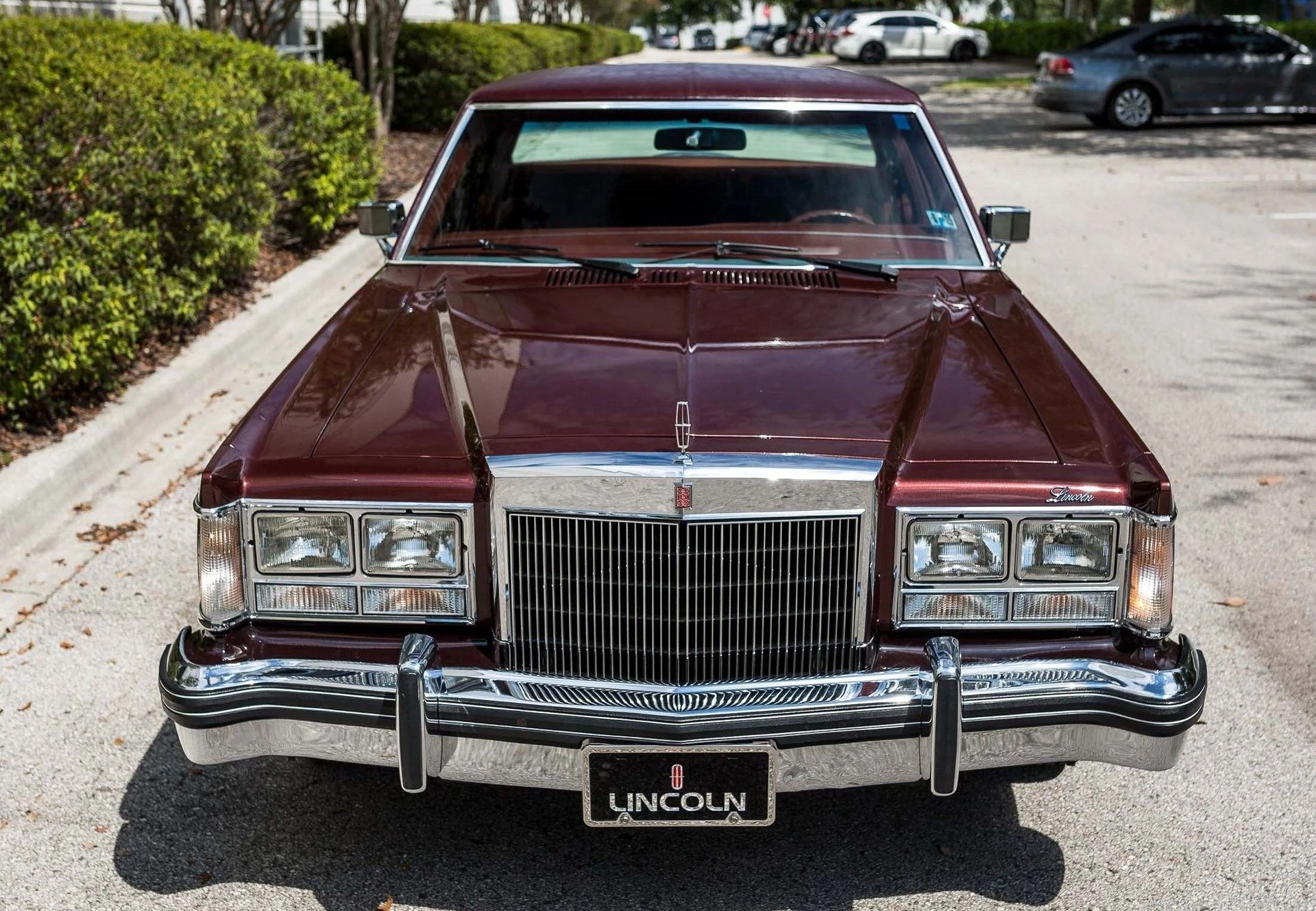 1977–1980 Lincoln Versailles: Slow-Selling, Cynical, But Very Profitable 5 High-angle front 3q view of a burgundy 1977 Lincoln Versailles