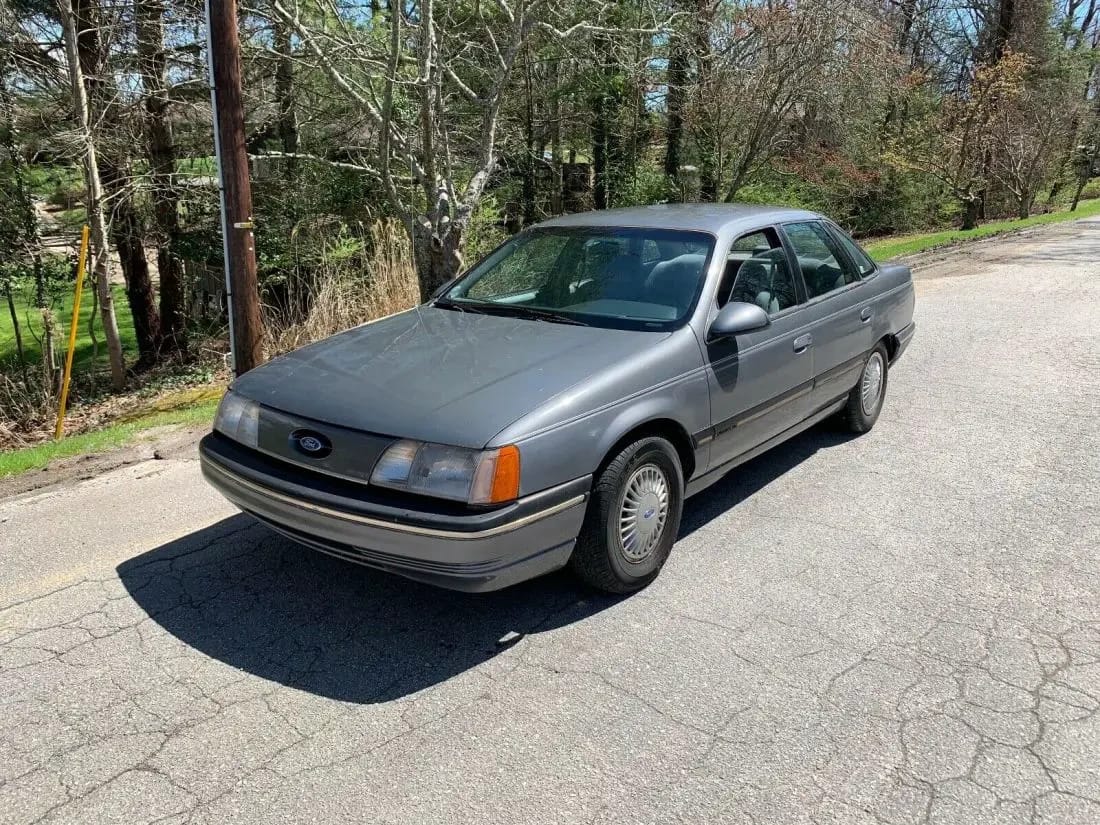 1960–1962 Plymouth Valiant Versus 1986–1991 Ford Taurus – Closer Than They Appear 5 Left front 3q view of a medium gray 1987 Ford Taurus sedan