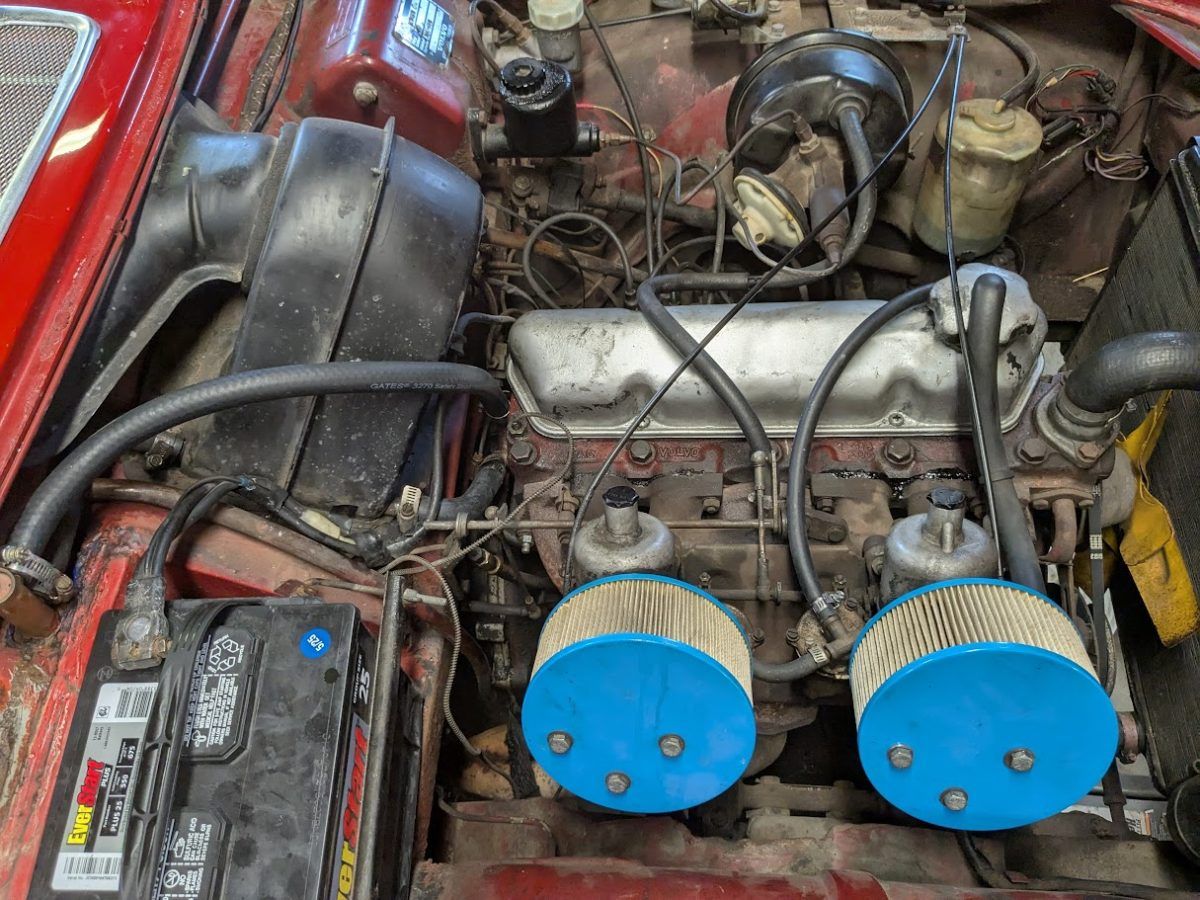 Volvo B18 engine under the hood of the Volvo 1800S