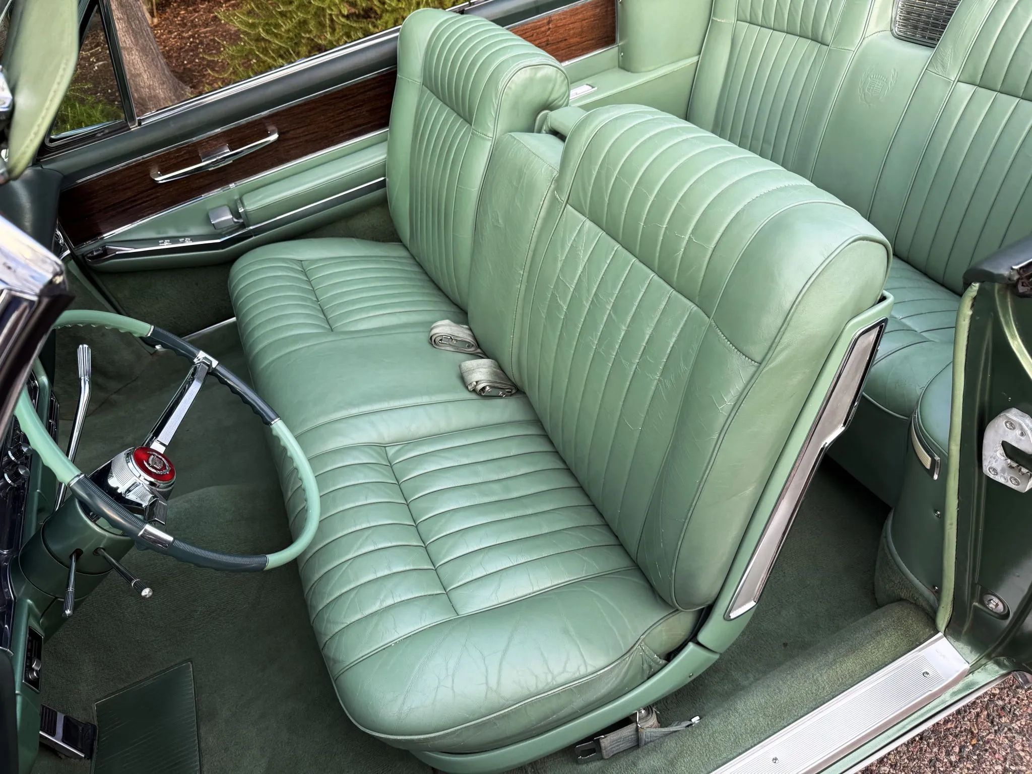 Color-Coordinated Cadillacs: Colorful Eldorados, De Villes, And Fleetwood Broughams 18 Front bench seat of a 1963 Cadillac Eldorado in green leather