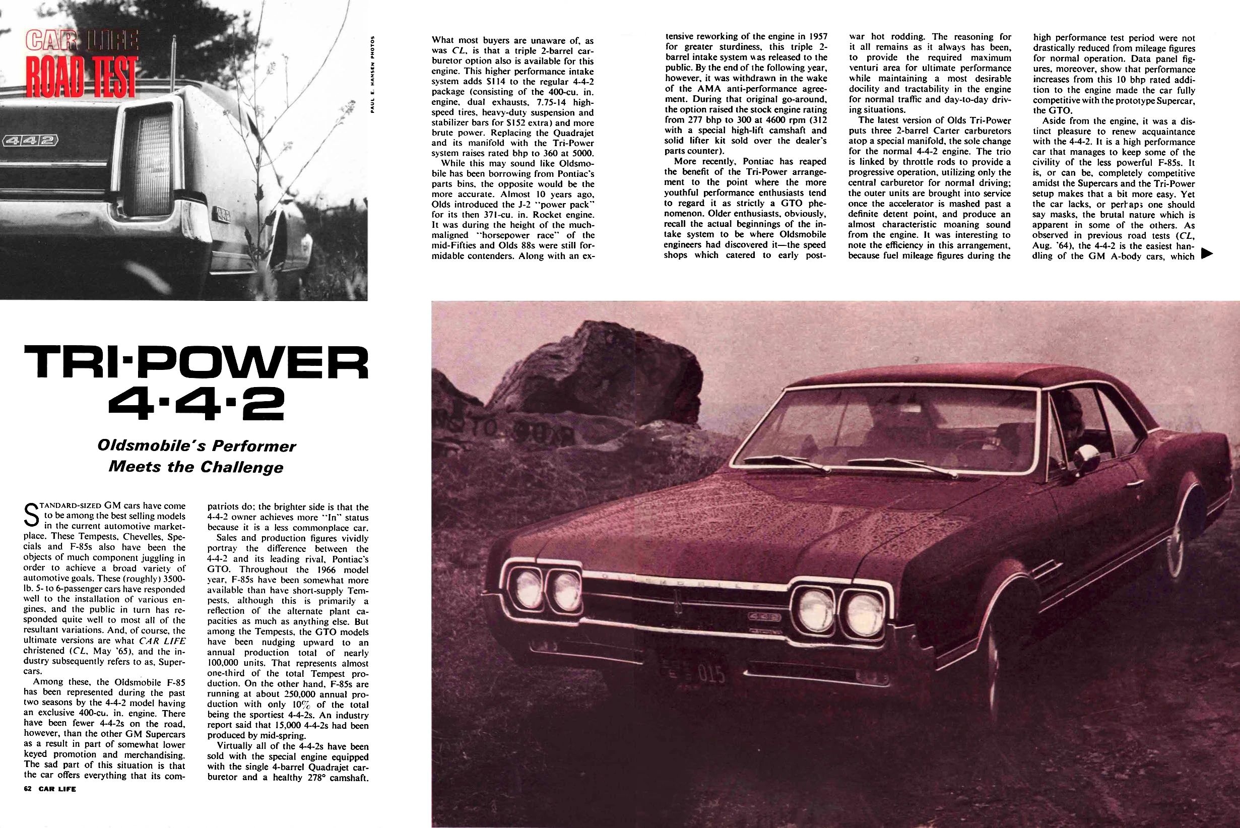 Car Life, August 1966, pages 62 and 63, first two-page spread of Oldsmobile 4-4-2 road test, with a photo of the right rear taillight and the headline "TRI-POWER 4-4-2: Oldsmobile's Performance Meets the Challenge" above the main text, and a red-tinted photo below the main text on the facing page, showing the front 3q of the test car on a rocky cliff