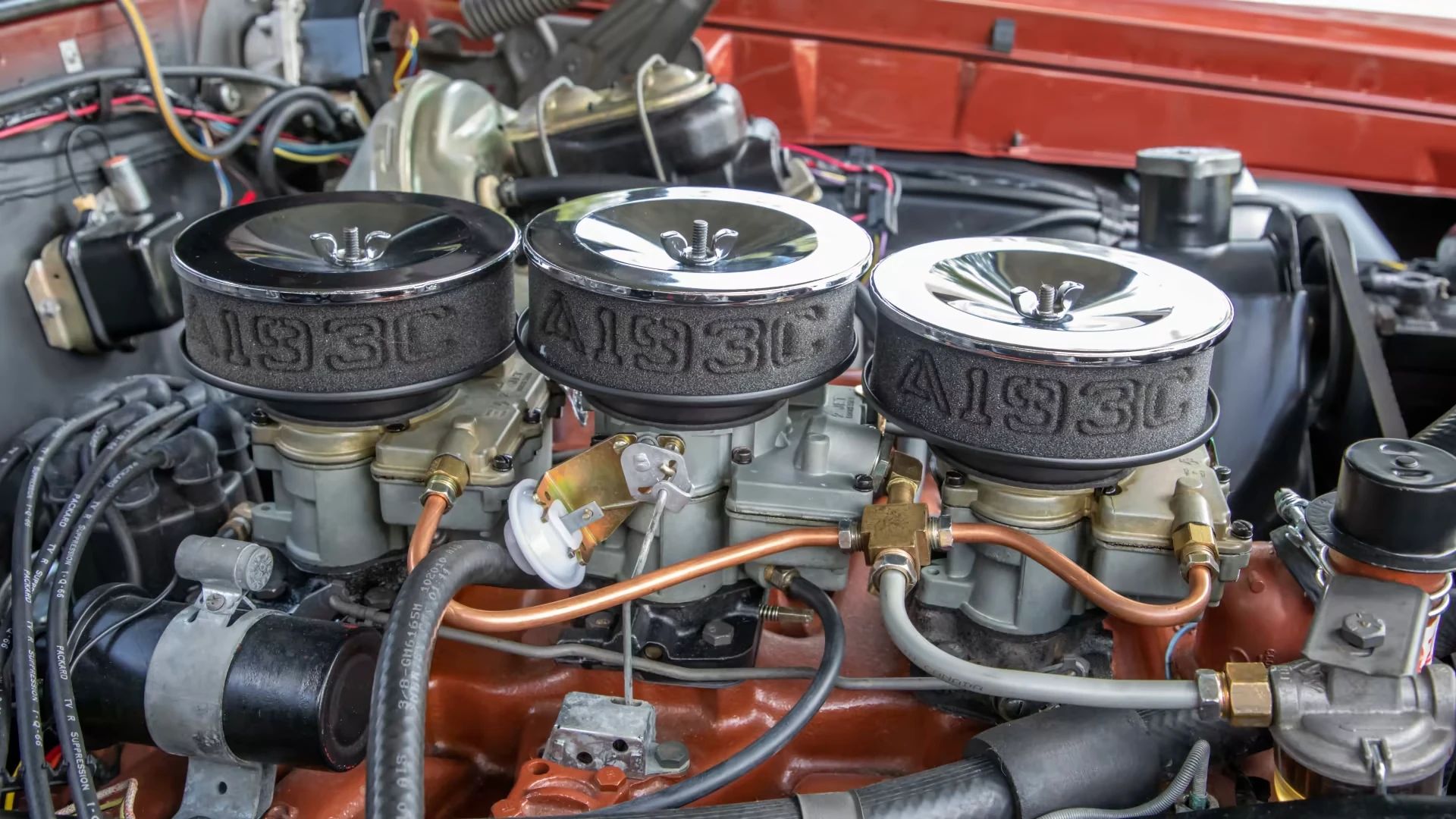 Triple Rochester carburetors on a 1966 Oldsmobile L69 engine