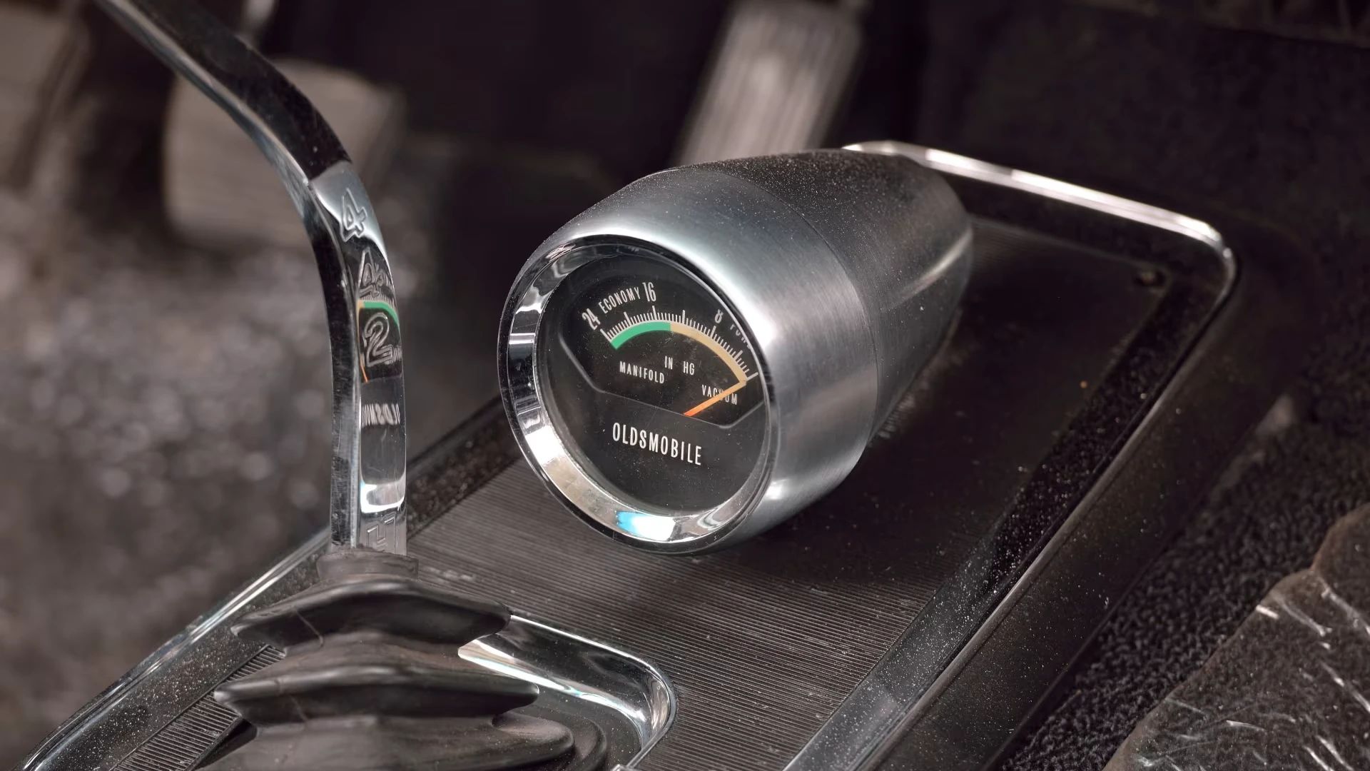 Performance (vacuum) gauge on the console of a 1966 Oldsmobile 4-4-2