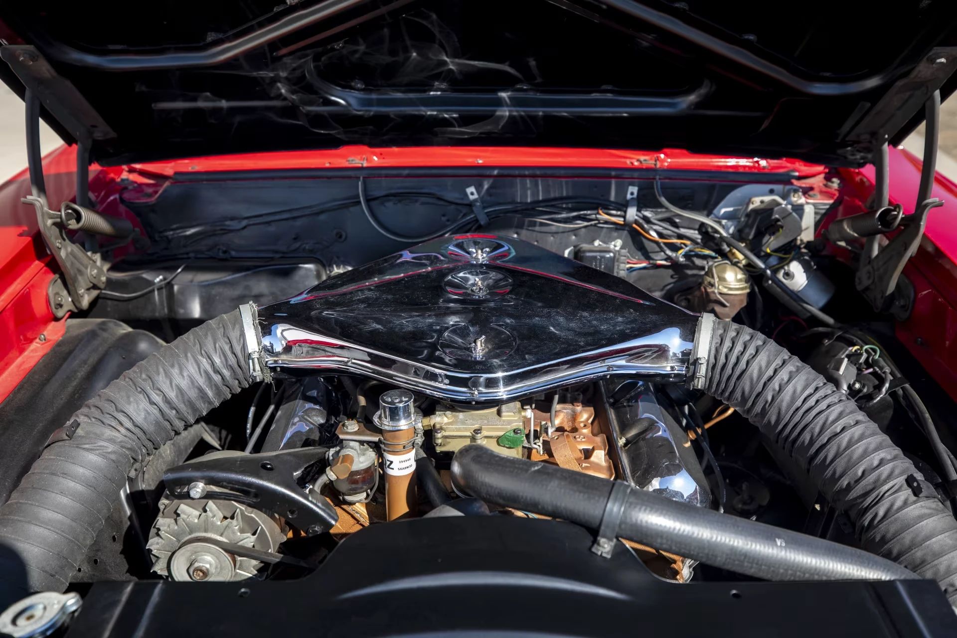 Oldsmobile W30 L69 engine in a Target Red 1969 Oldsmobile 4-4-2