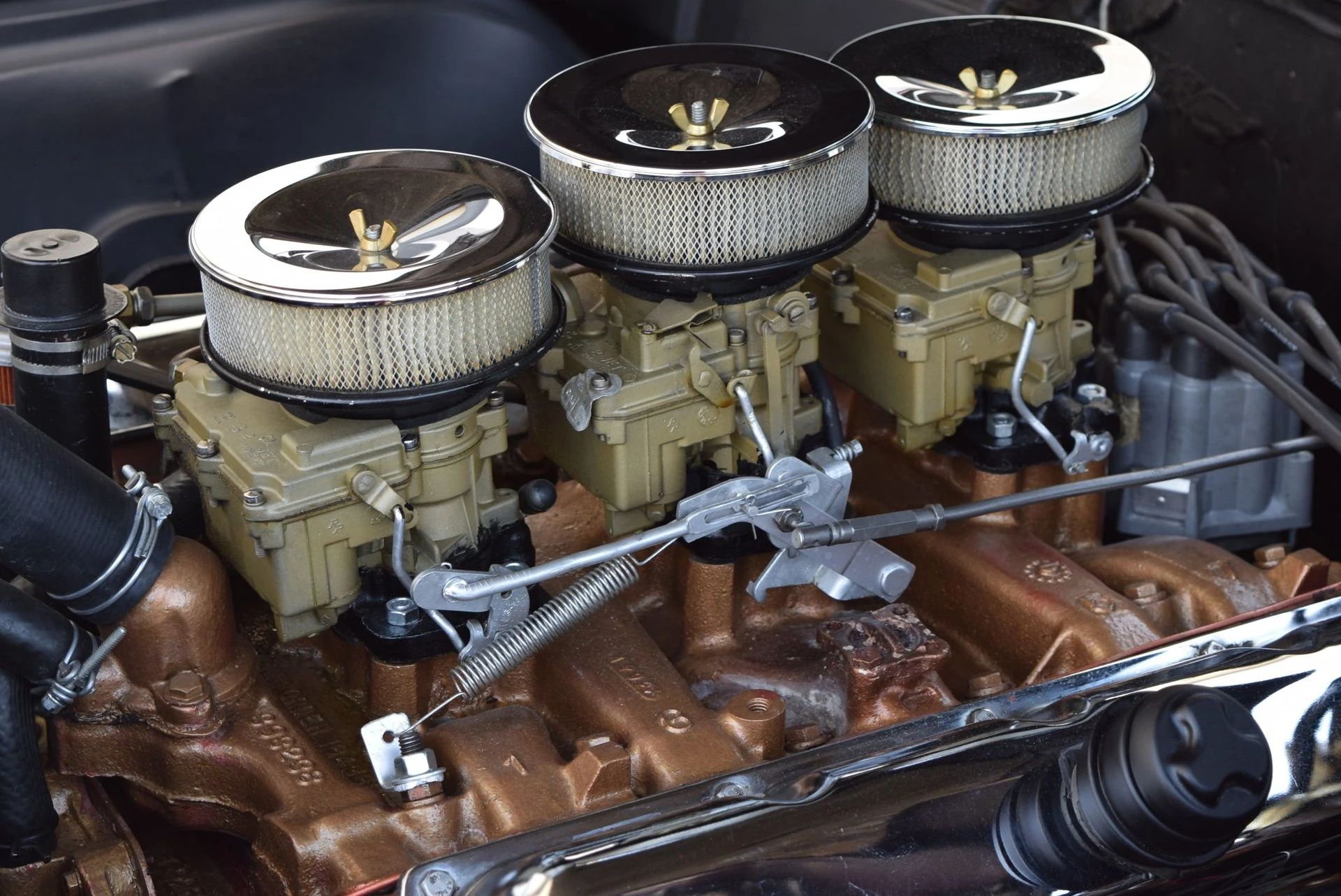 Triple Rochester carburetors on a 1966 Oldsmobile L69 engine