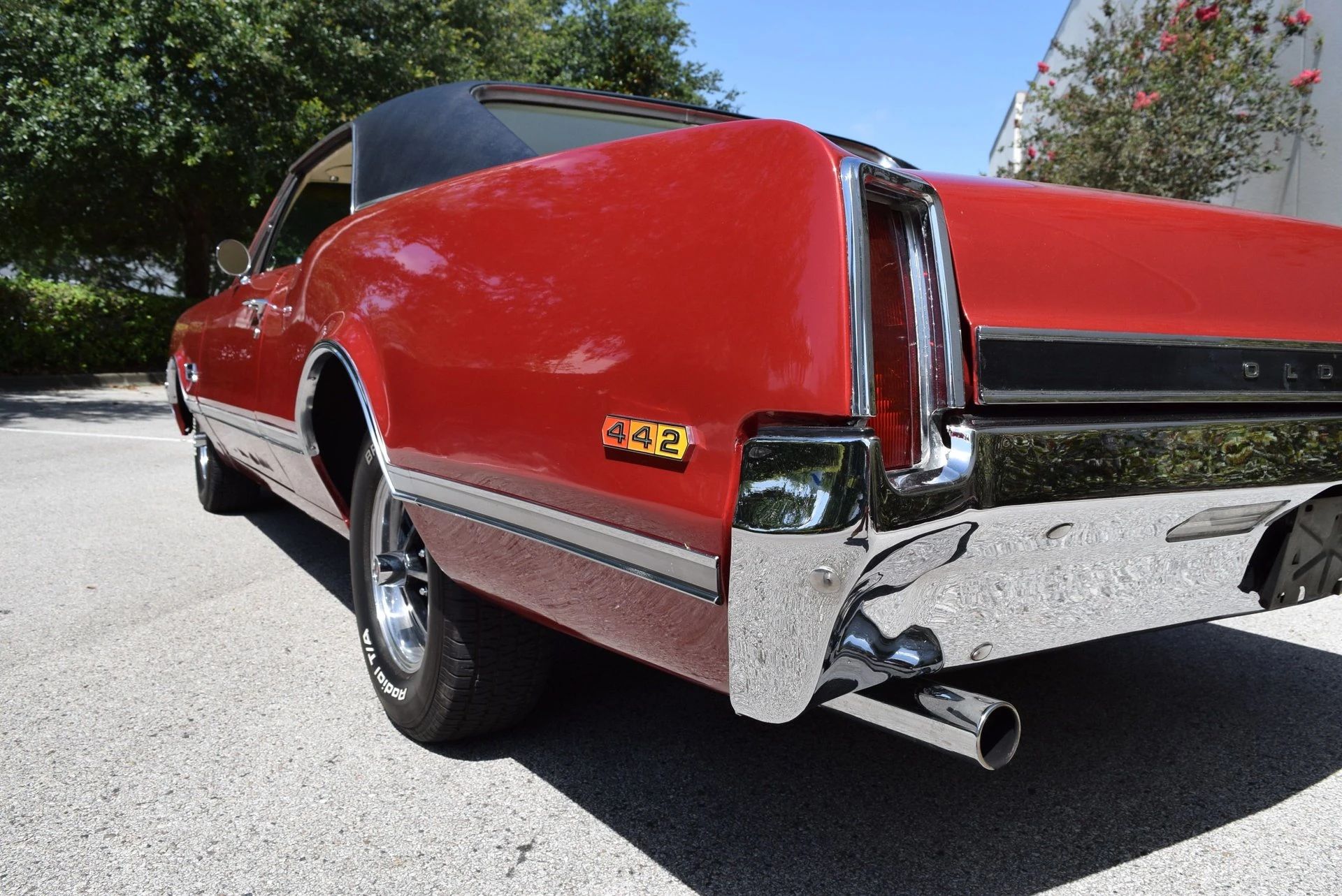 Left rear flank of a red 1966 Oldsmobile 4-4-2 hardtop