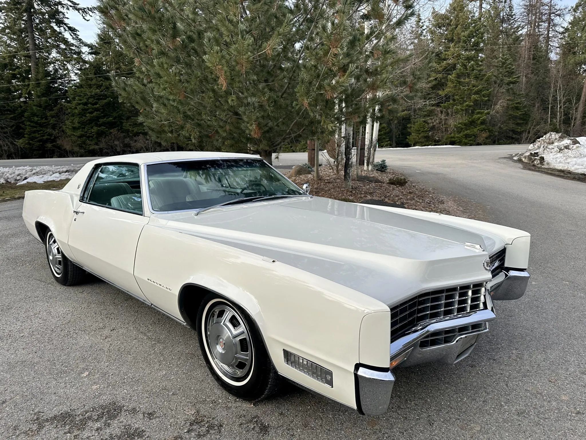 Color-Coordinated Cadillacs: Colorful Eldorados, De Villes, And Fleetwood Broughams 34 Right front 3q view of a white 1967 Cadillac Eldorado with a matching vinyl top