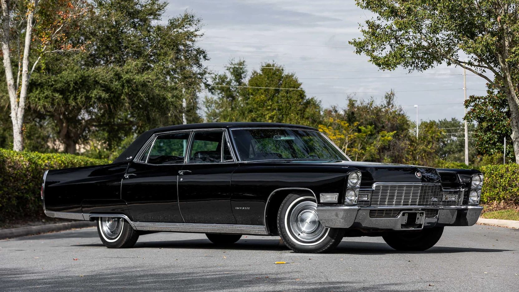 Color-Coordinated Cadillacs: Colorful Eldorados, De Villes, And Fleetwood Broughams 3 Right front 3q view of a black 1968 Cadillac Fleetwood Brougham with a matching vinyl roof