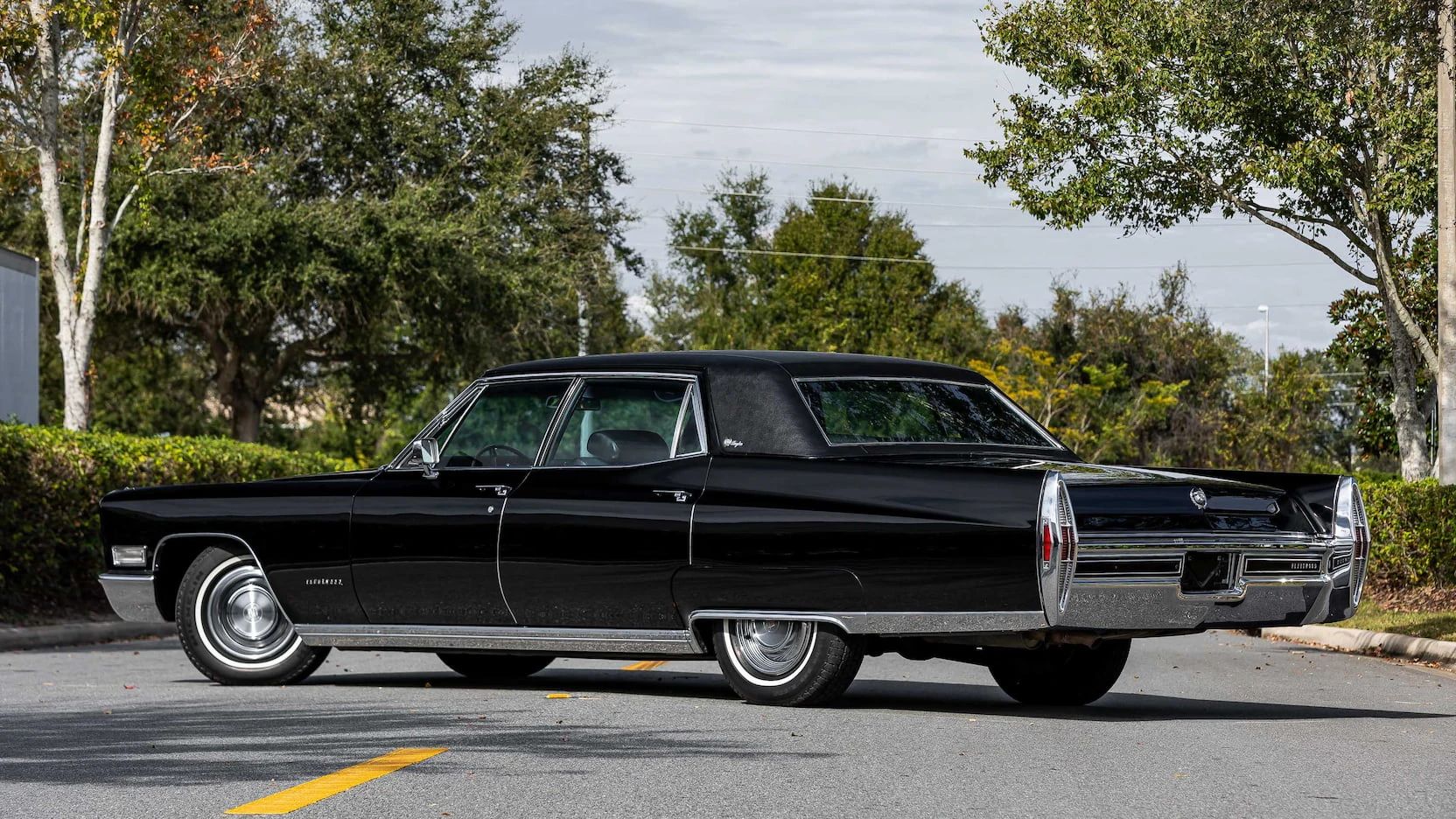 Color-Coordinated Cadillacs: Colorful Eldorados, De Villes, And Fleetwood Broughams 4 Left rear 3q view of a black 1968 Cadillac Fleetwood Brougham with a matching vinyl roof