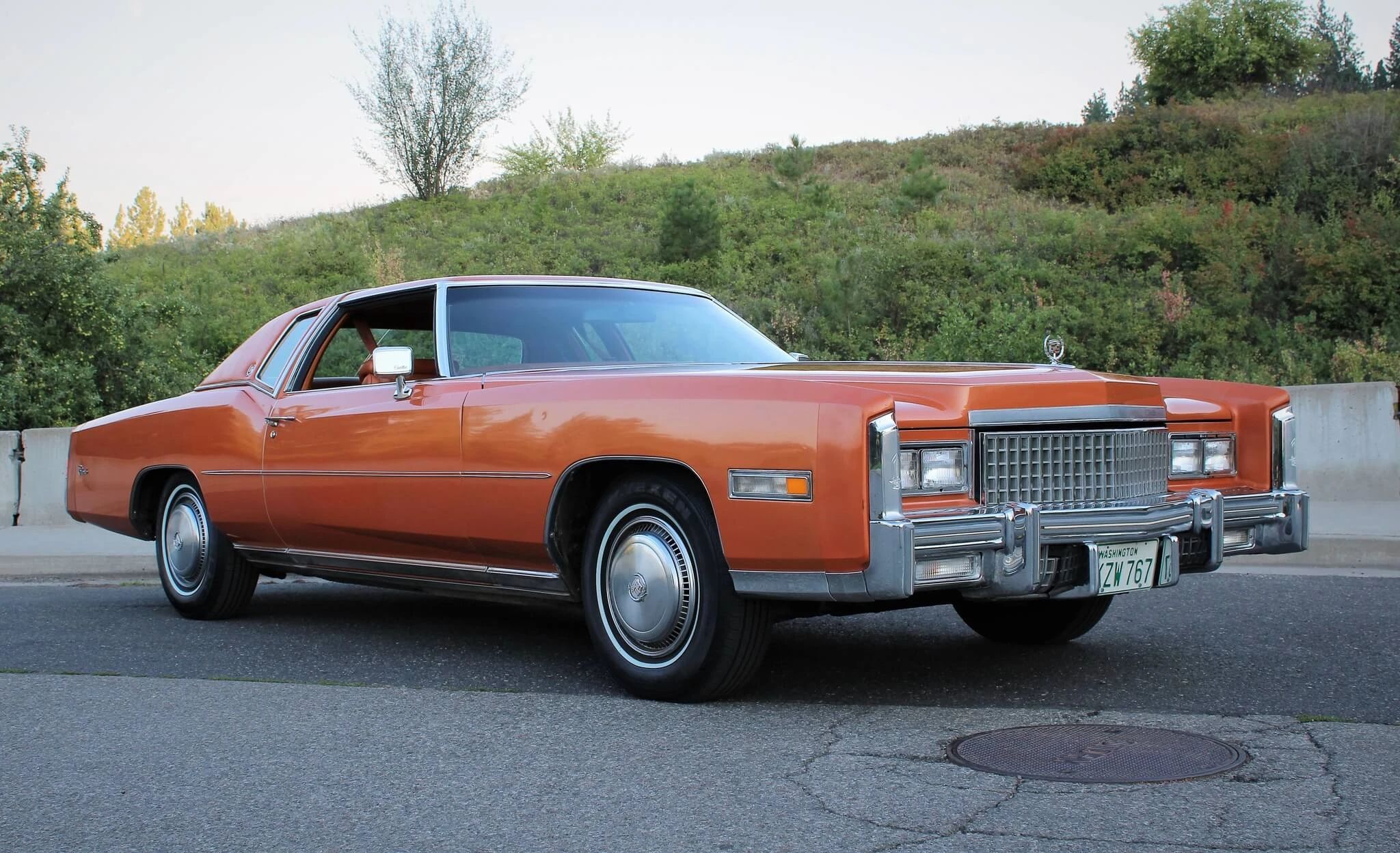 Color-Coordinated Cadillacs: Colorful Eldorados, De Villes, And Fleetwood Broughams 10 Front 3q view of an orange 1975 Cadillac Eldorado hardtop with matching vinyl top