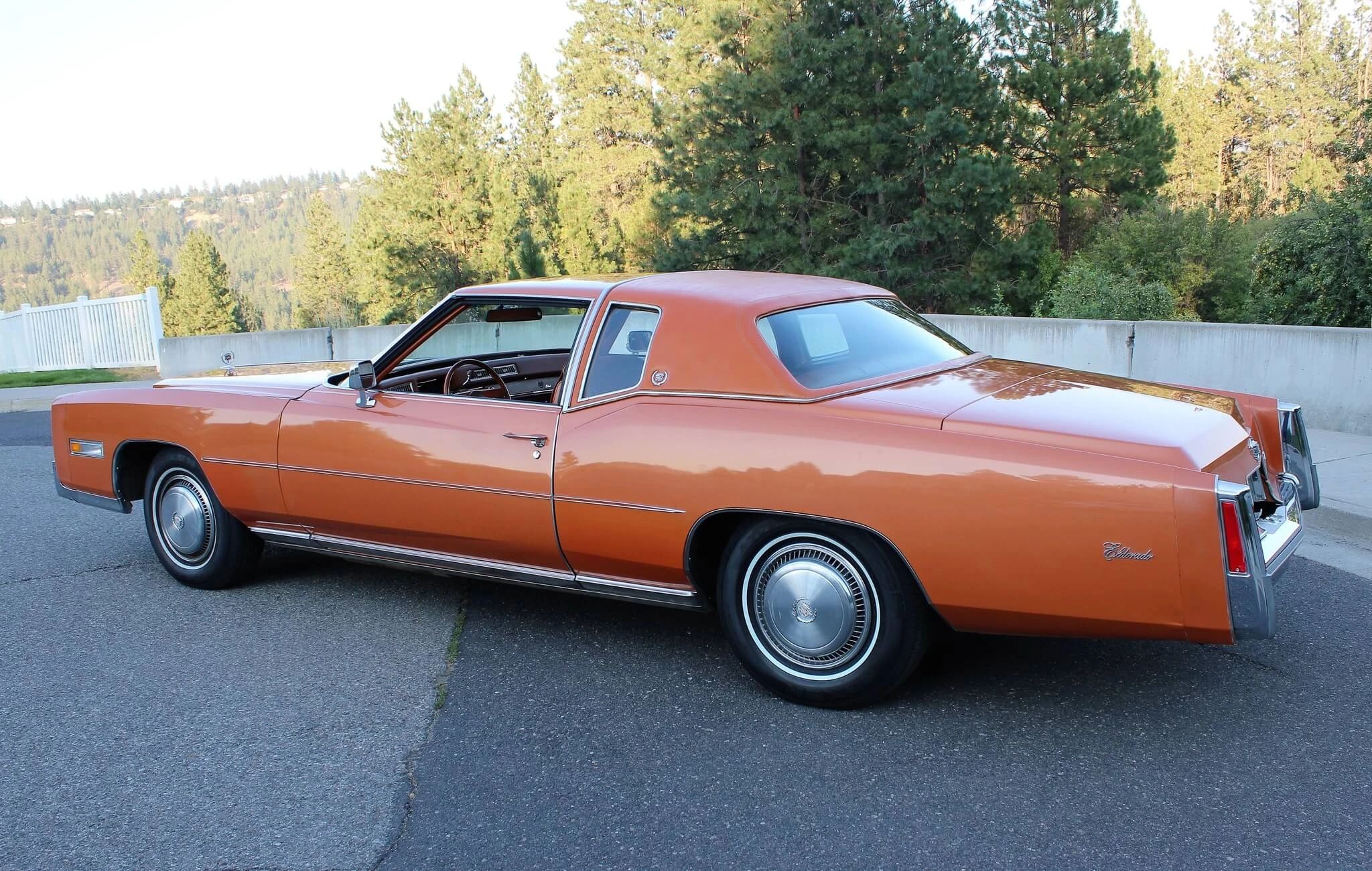 Color-Coordinated Cadillacs: Colorful Eldorados, De Villes, And Fleetwood Broughams 11 Left rear 3q view of an orange 1975 Cadillac Eldorado with a matching vinyl top