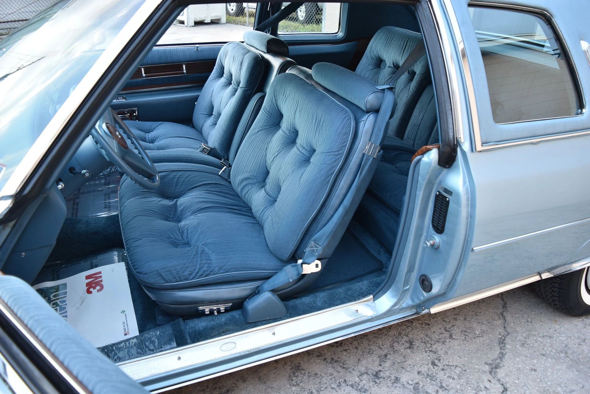 Color-Coordinated Cadillacs: Colorful Eldorados, De Villes, And Fleetwood Broughams 23 Front seat of a blue 1976 Cadillac Coupe de Ville with blue velour upholstery