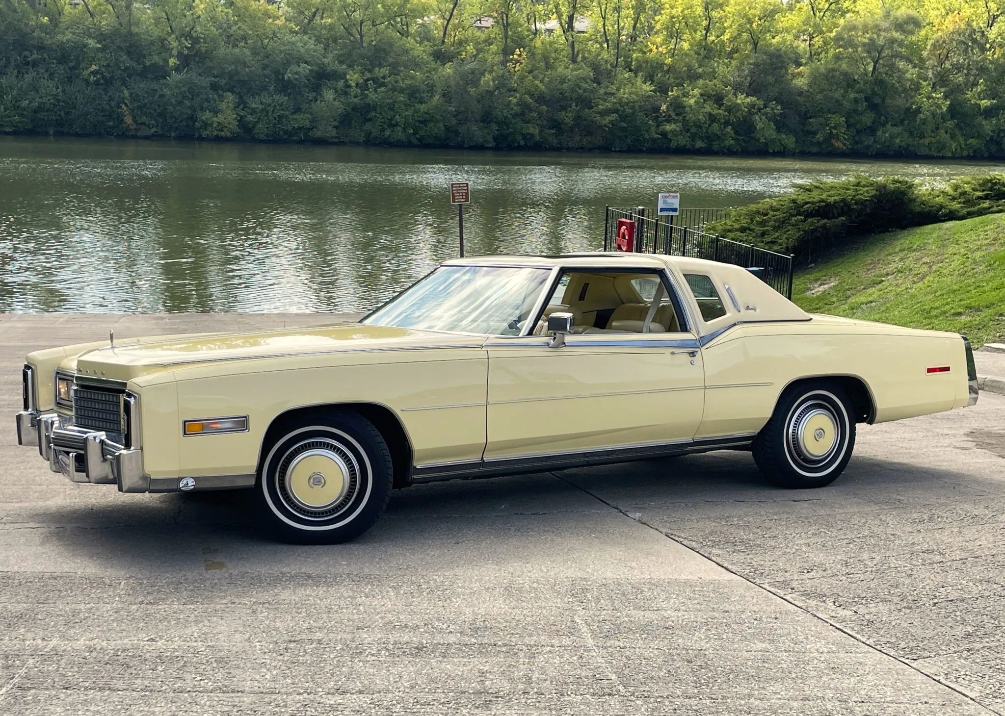 Color-Coordinated Cadillacs: Colorful Eldorados, De Villes, And Fleetwood Broughams 13 Left front 3q view of a yellow 1978 Cadillac Eldorado hardtop with a matching vinyl top and wheel discs