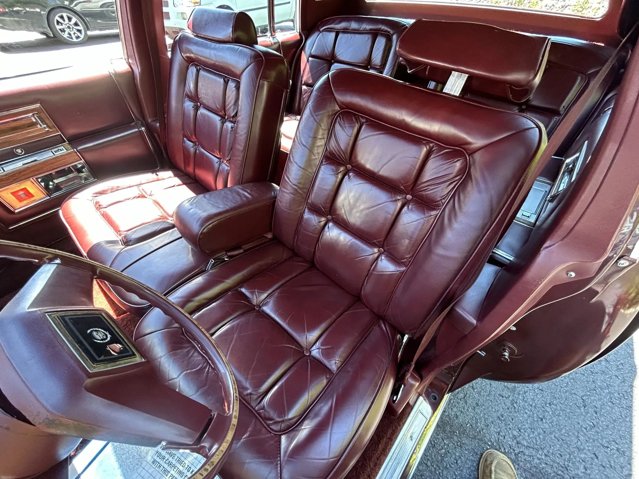 Color-Coordinated Cadillacs: Colorful Eldorados, De Villes, And Fleetwood Broughams 29 Front seat of a 1983 Cadillac Fleetwood Brougham with maroon leather