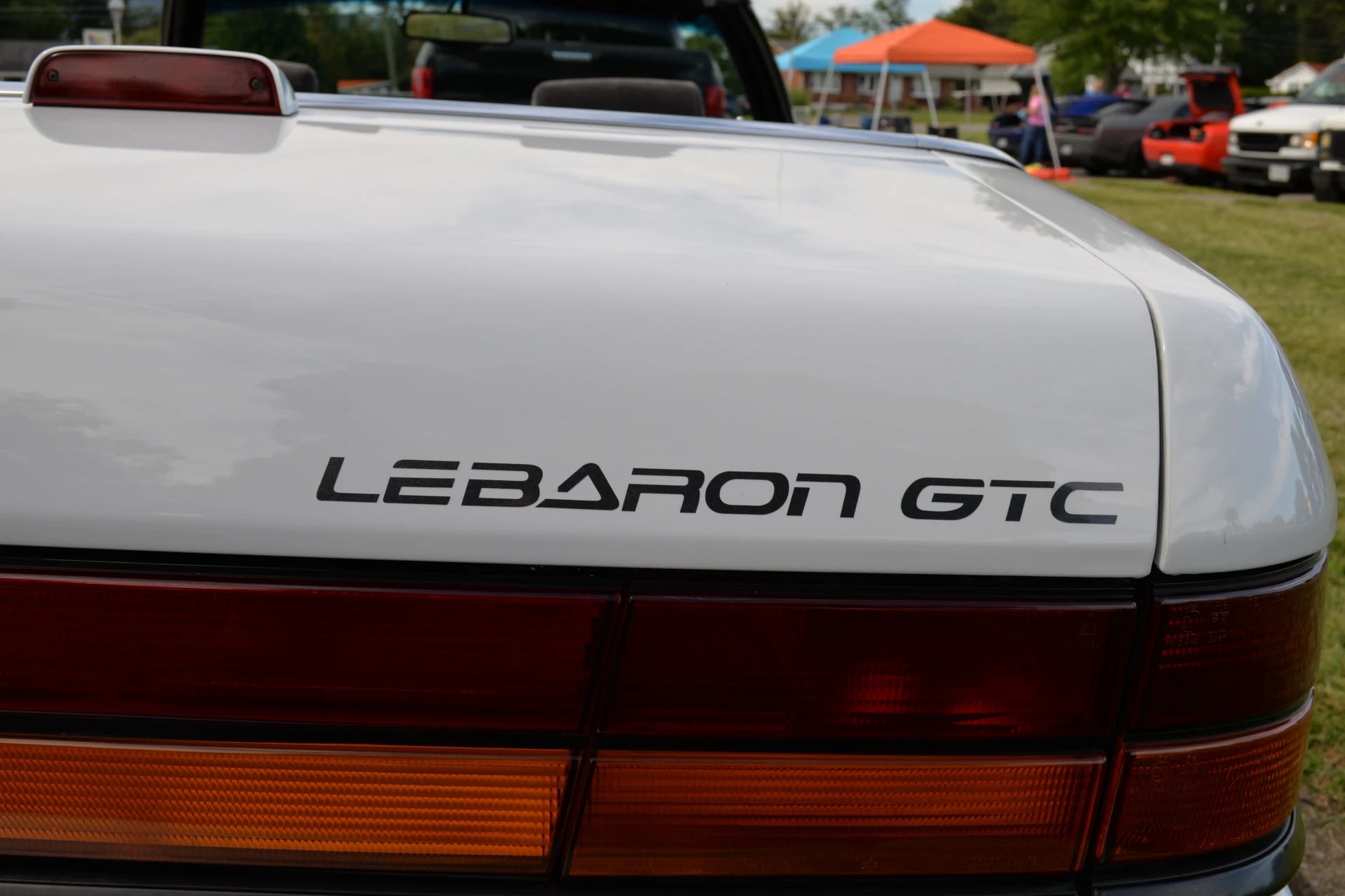 1994–1995 Chrysler LeBaron GTC Convertible – A Rental Car Favorite Nears Its Final Curtain 8 LeBaron GTC decal on the decklid of a white 1994 or 1995 Chrysler LeBaron convertible