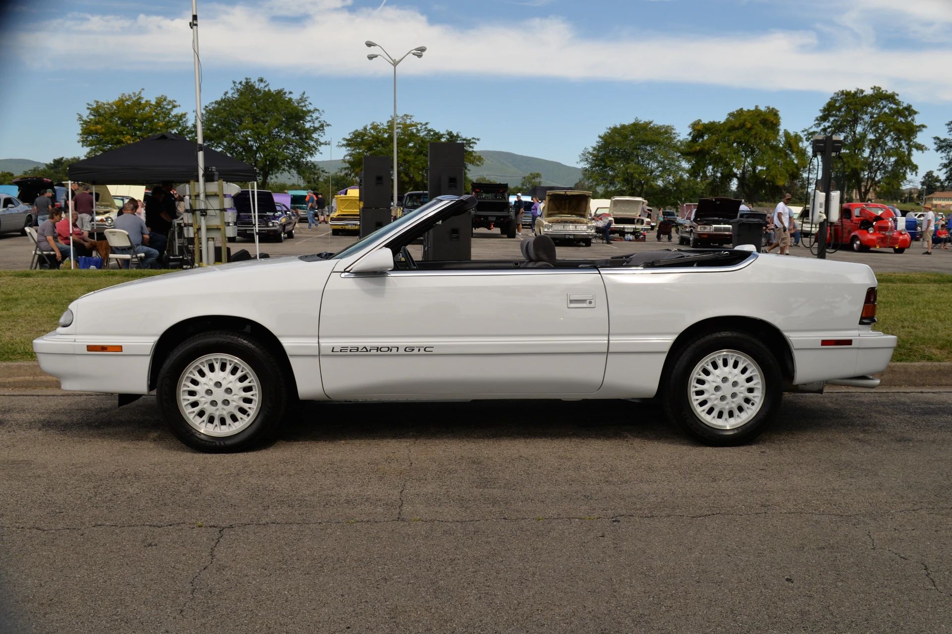 1994–1995 Chrysler LeBaron GTC Convertible – A Rental Car Favorite Nears Its Final Curtain 5 Left side of a white 1994 or 1995 Chrysler LeBaron convertible with its top down and matching white alloy wheels