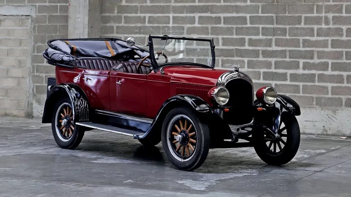 First And Last Plymouths: 1928 Plymouth Model Q and 2001 Plymouth Neon LX 6 Right front 3q view of a red 1927 Chrysler Series 52 touring with the top down
