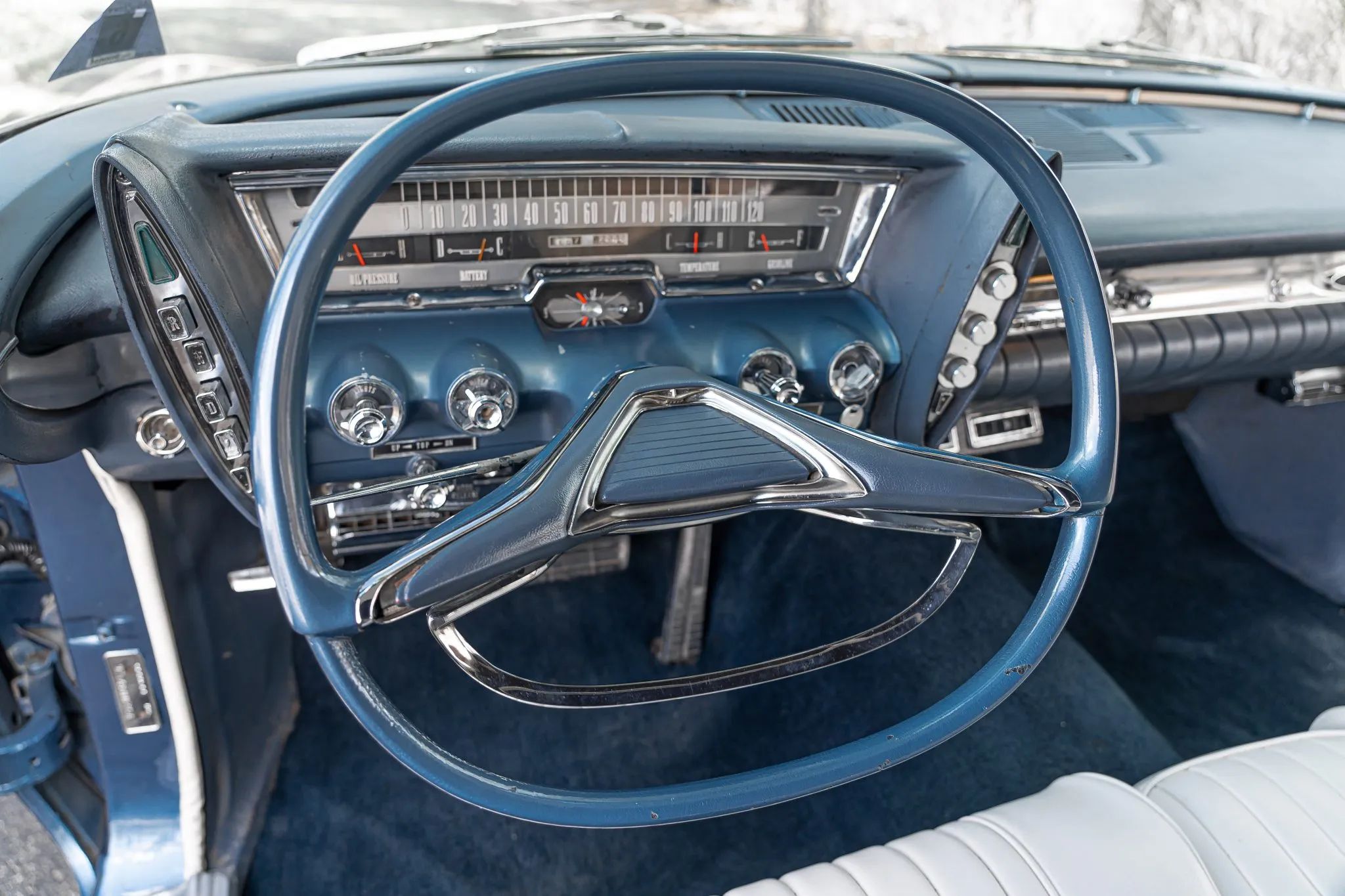 From Chrome To Clear Plastic: Bold Steering Wheels Of The 1950s & 1960s 30 Dashboard and oval steering wheel of a 1961 Imperial Crown convertible with a blue dashboard