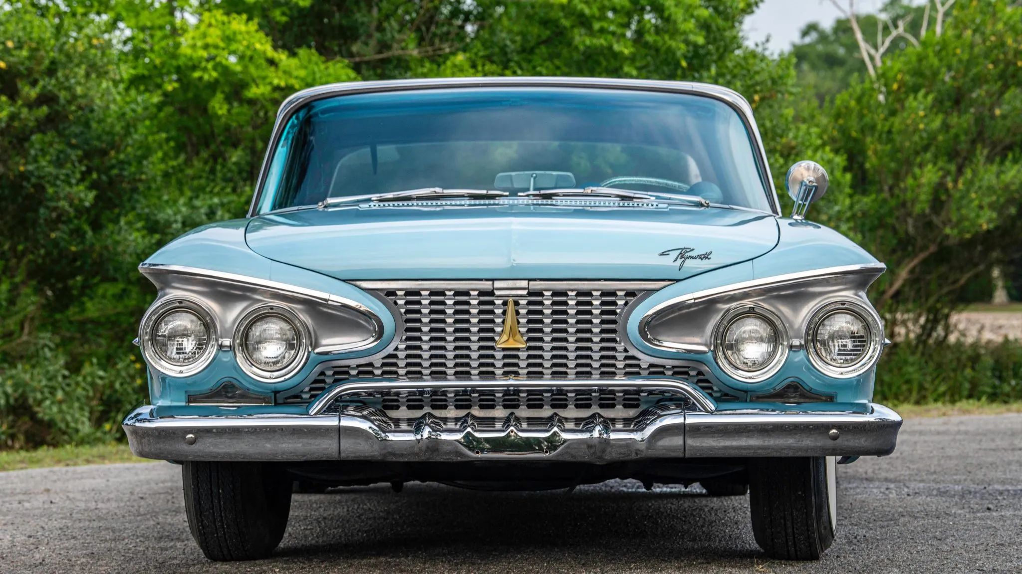 From Chrome To Clear Plastic: Bold Steering Wheels Of The 1950s & 1960s 6 Front view of a Robin's Egg Blue 1961 Plymouth Fury convertible