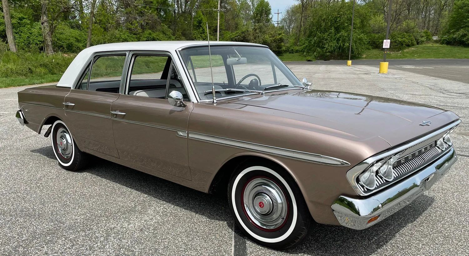 Right front 3q view of a coral 1963 Rambler Classic four-door sedan with a white roof