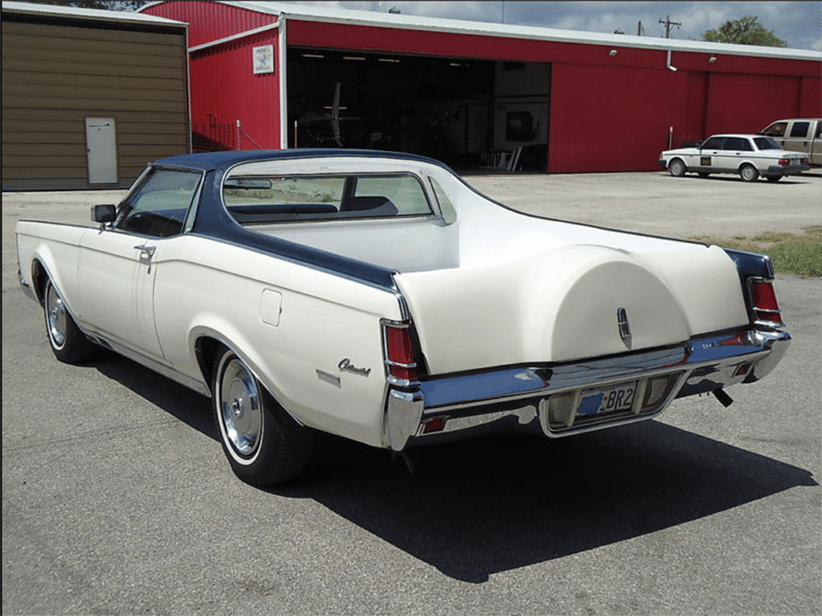 Image of a blue and white Lincoln Continental MarkIV pickup custom job, seen from the rear three quarter view.