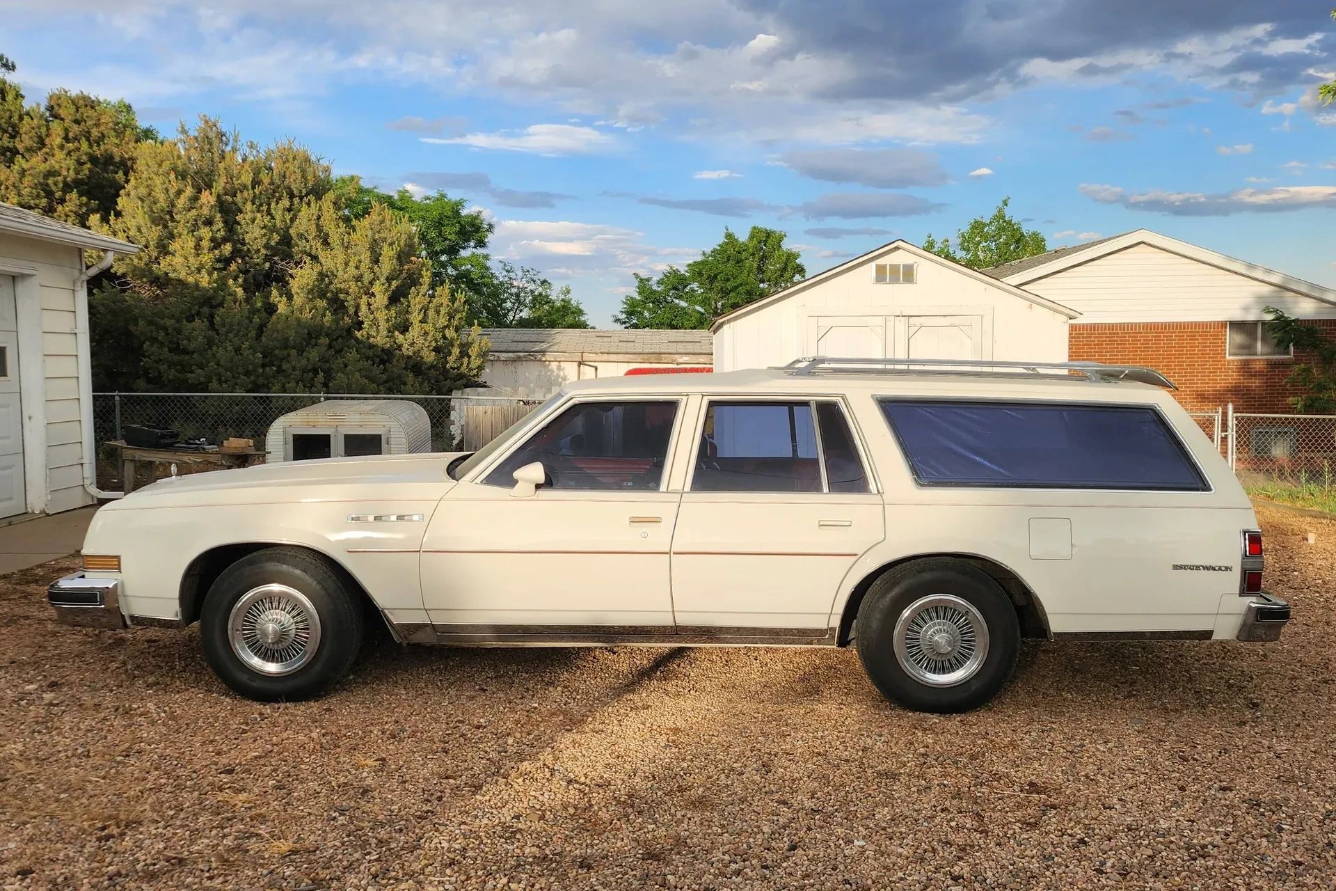 1990 Buick Estate Wagon: Luxurious Family Hauler The Old-Fashioned Way 2 Left side view of a white 1977 Buick Estate Wagon four-door station wagon