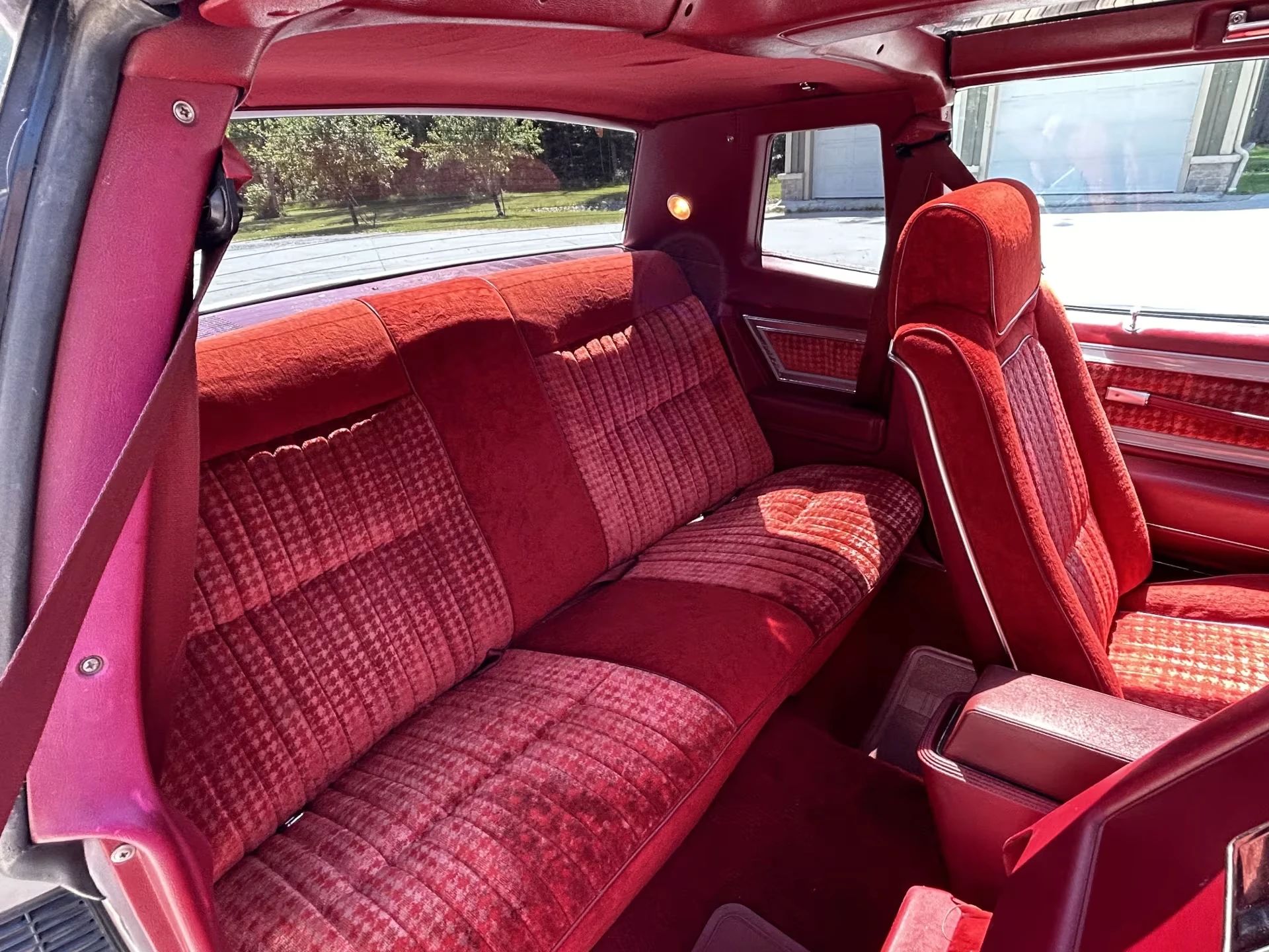 Vintage M/T Road Test: 1979 Pontiac Grand Prix SJ – Rare 4-Speed Manual In A Pontiac PLC Placeholder 16 Back seat of a 1979 Pontiac Grand Prix with red cloth bucket front seats, seen through the passenger door