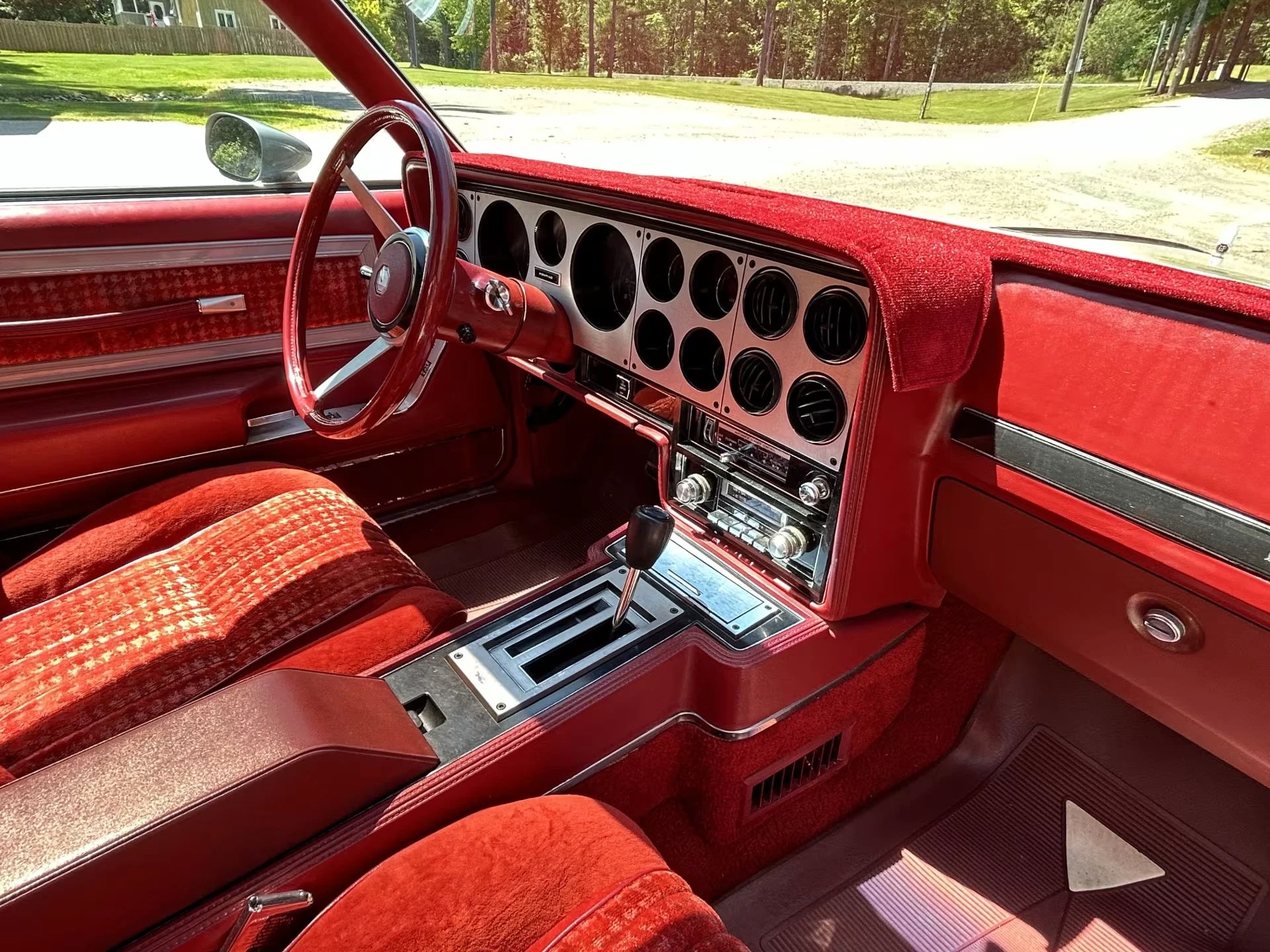 Vintage M/T Road Test: 1979 Pontiac Grand Prix SJ – Rare 4-Speed Manual In A Pontiac PLC Placeholder 15 Right side of the dashboard of a 1979 Pontiac Grand Prix with red cloth buckets