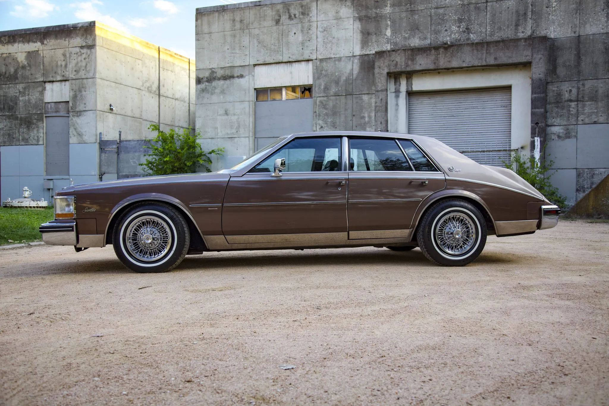 1985 Cadillac De Ville 4.3 V-6 Diesel: The Most Underpowered Cadillac Since Before WW2 11 Left side view of a two-tone Desert Dusk/Brownstone 1982 Cadillac Seville