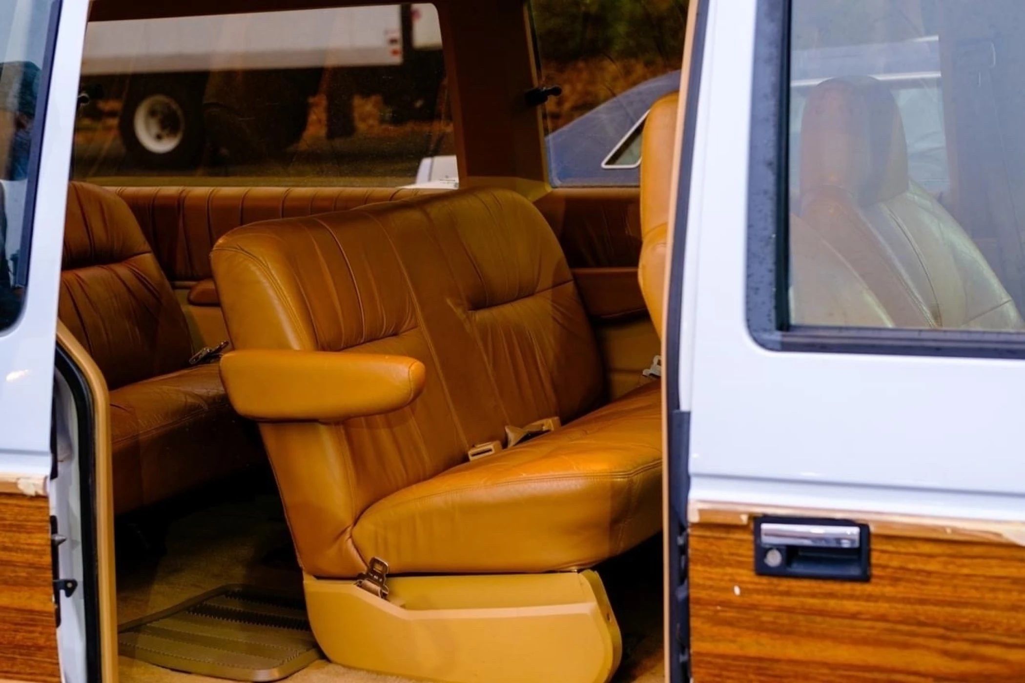1990 Buick Estate Wagon: Luxurious Family Hauler The Old-Fashioned Way 21 Second-row seat of a 1990 Chrysler Town & Country, glimpsed through the side door