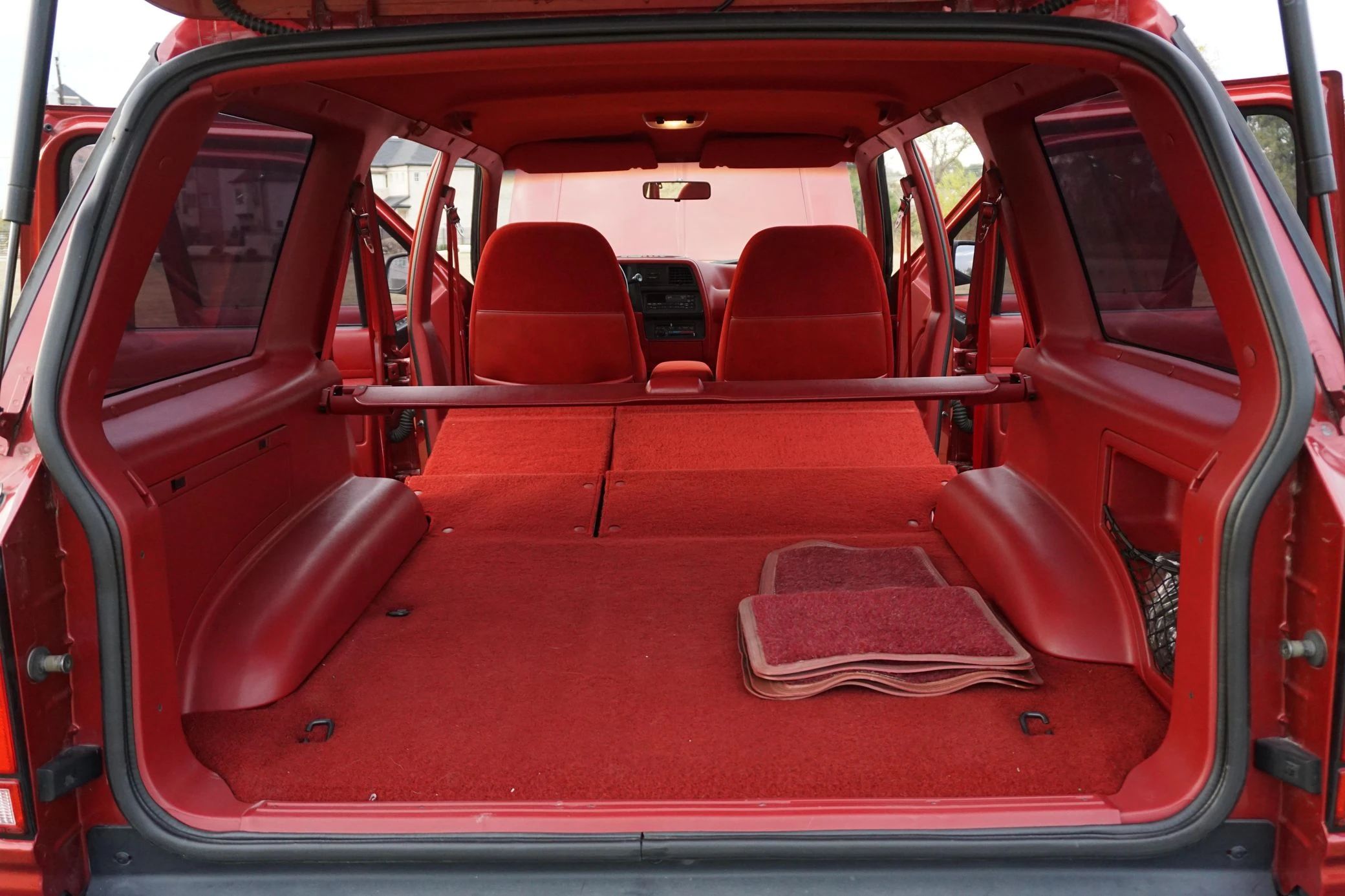 1990 Buick Estate Wagon: Luxurious Family Hauler The Old-Fashioned Way 30 Cargo area of a 1991 Ford Explorer with red interior