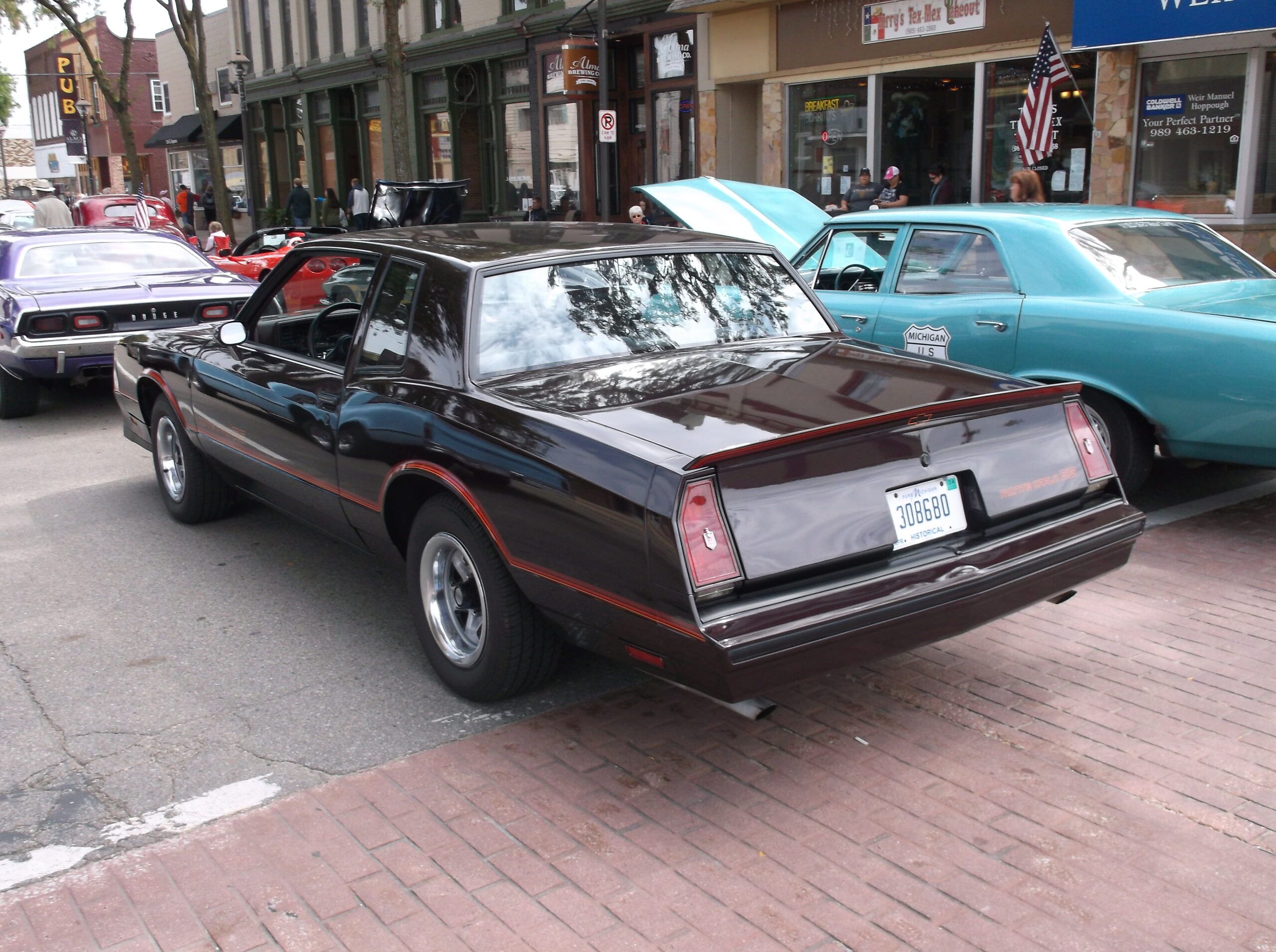 Forgotten Concept: 1985 Oldsmobile Cutlass FE3-X "Darth Vader" – A Would-Be Grand National From Lansing 2 Picture of 1980s Monte Carlo SS painted a black cherry color on small town street at a local car show
