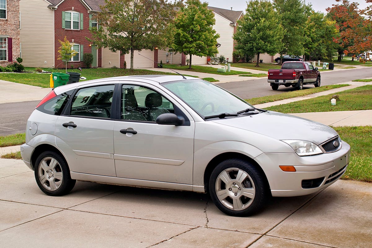 My 2006 Ford Focus: Serving Three Generations of Greys 1 2006 Ford Focus 5-door hatchback parked on a driveway