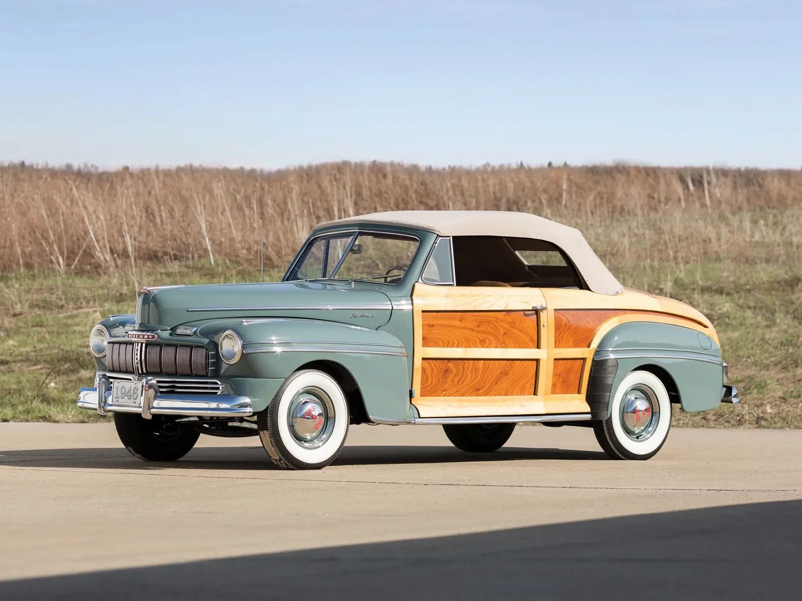 Left front 3q view of a bluish green 1946 Mercury Sportsman wood-bodied convertible