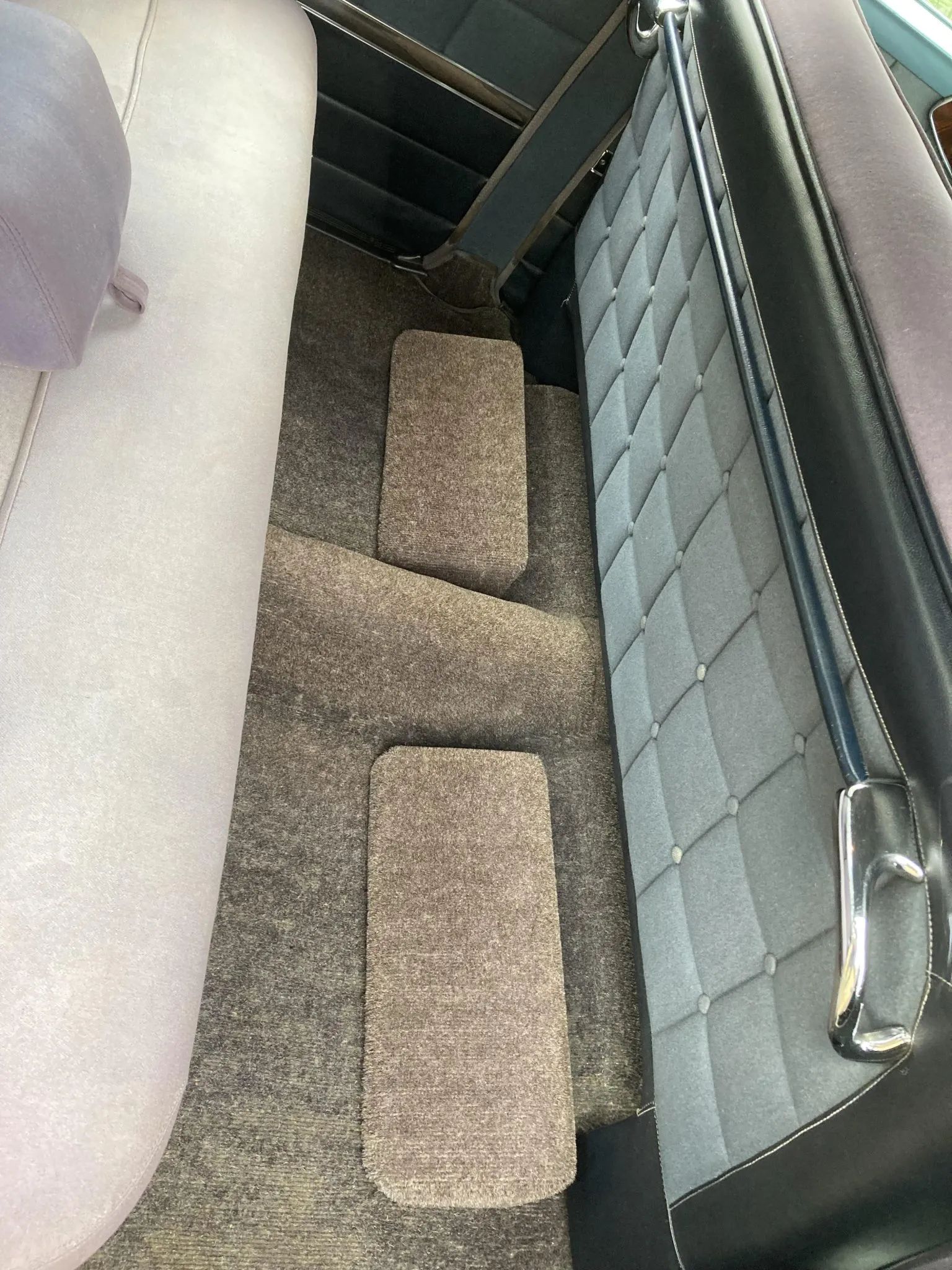 Foot hassocks in the rear footwells of a 1953 Chrysler C-58 Custom Imperial