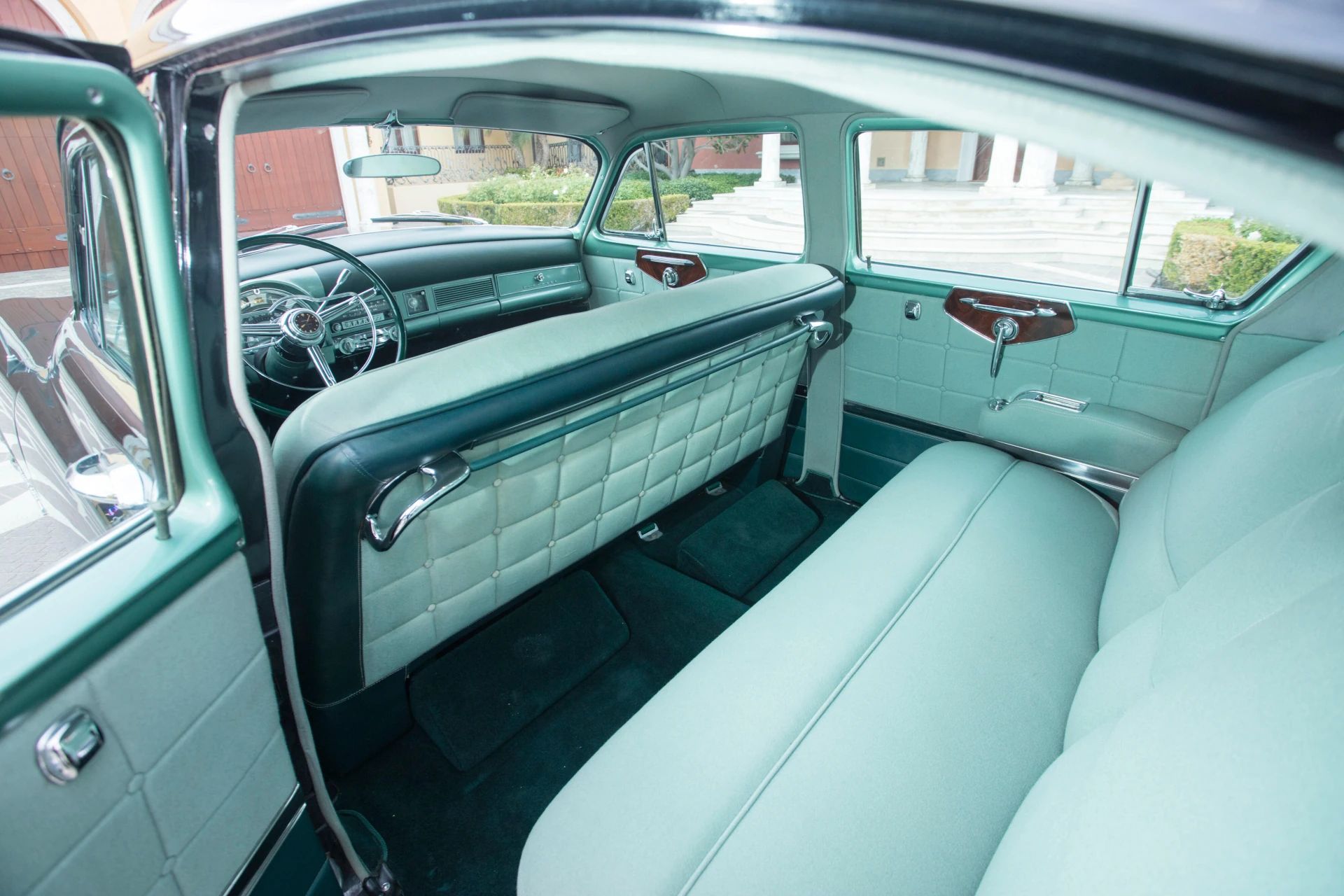 Back seat of a 1953 Chrysler C-58 Custom Imperial with green interior