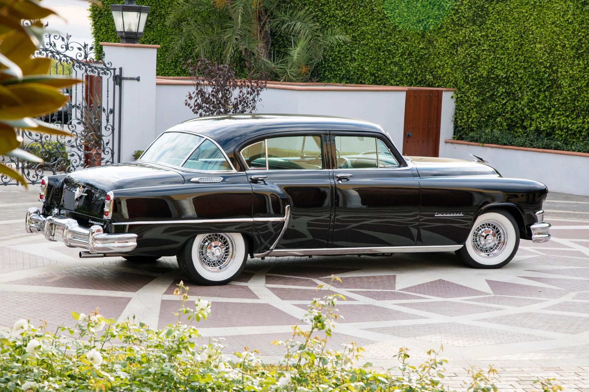 Right rear 3q view of black 1953 Chrysler C-58 Custom Imperial sedan with wire wheels