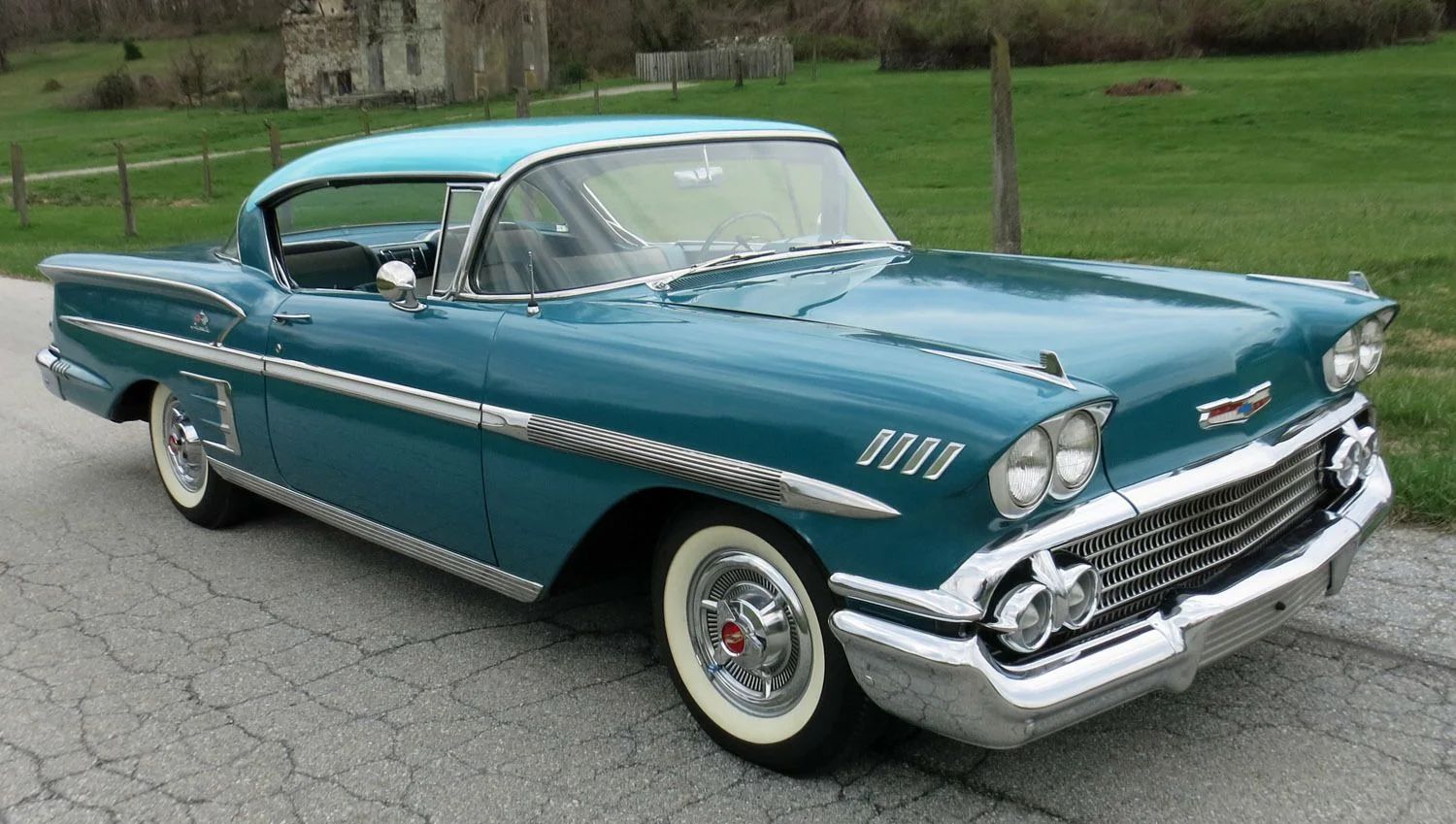 Right front 3q view of a two-tone turquoise 1958 Chevrolet Impala two-door hardtop