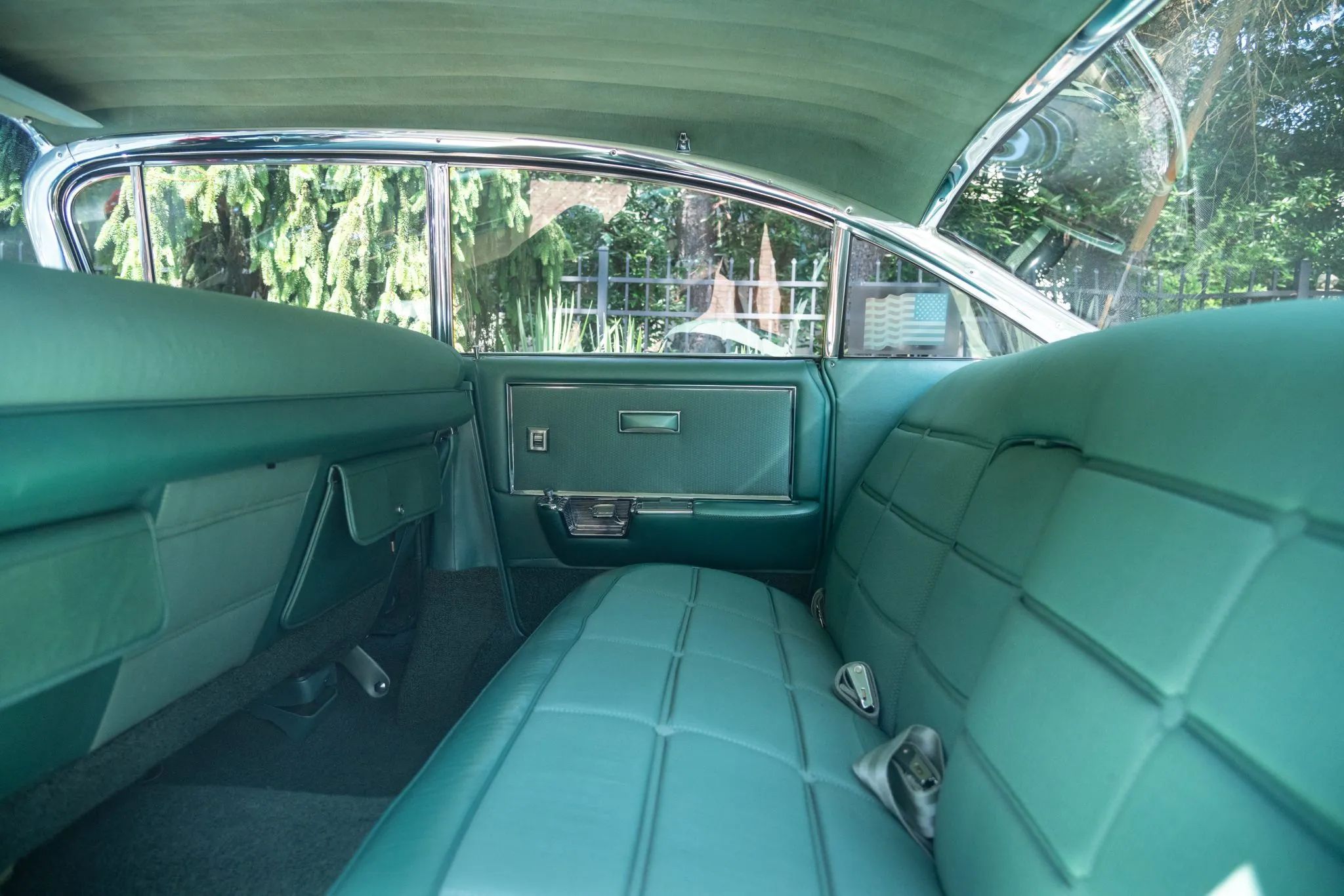 1960 Cadillac Fleetwood Sixty Special: Enviably Green, But No A/C 18 Back seat of a 1960 Cadillac Fleetwood Sixty Special four-door hardtop with a green interior
