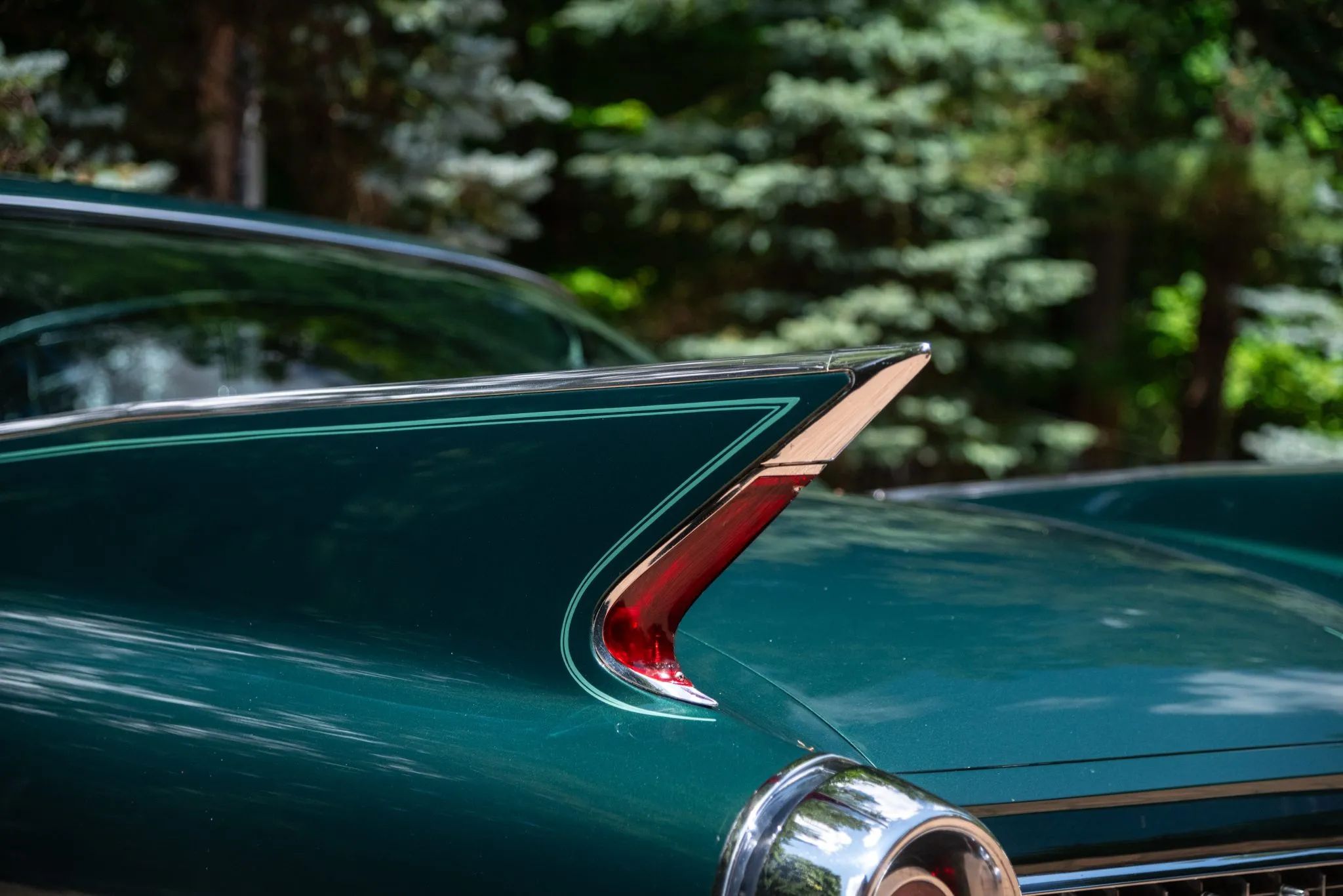 1960 Cadillac Fleetwood Sixty Special: Enviably Green, But No A/C 2 Left tail fin of a green 1960 Cadillac Fleetwood Sixty Special four-door hardtop