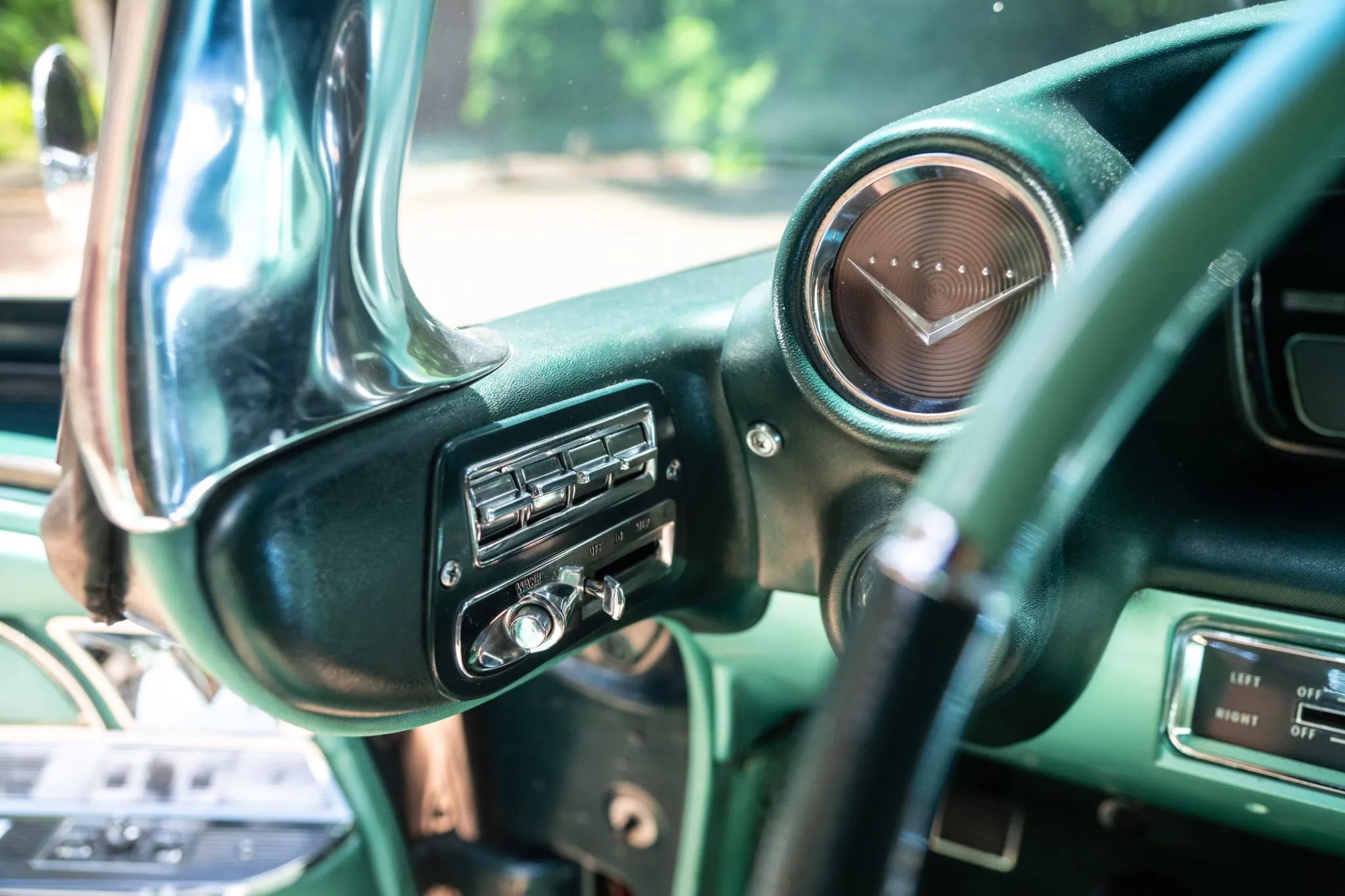 1960 Cadillac Fleetwood Sixty Special: Enviably Green, But No A/C 9 Power windows and wiper controls on the dogleg pillar of a 1960 Cadillac with a green interior