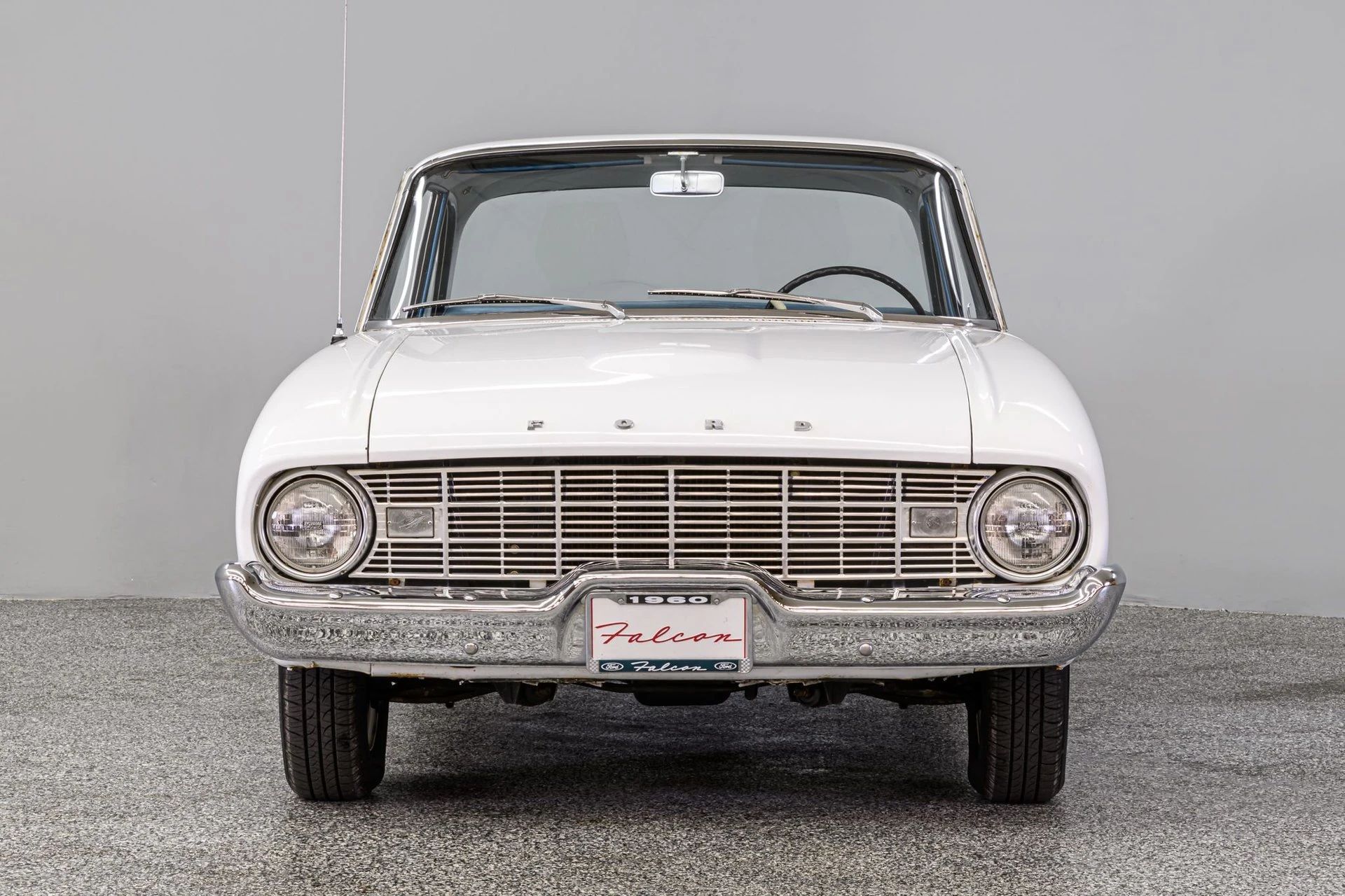 Front view of a white 1960 Ford Falcon sedan